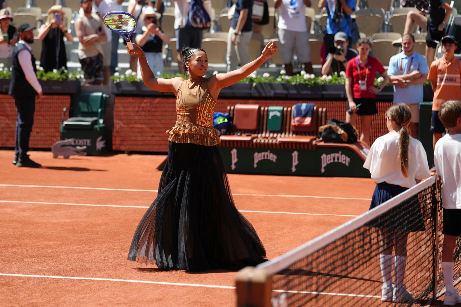Naomi Osaka of Japan gestures before the first round women's singles tennis match against Laura Siegemund of Germany at the French Open on Tuesday. (AP Photo/Aurelien Morissard)