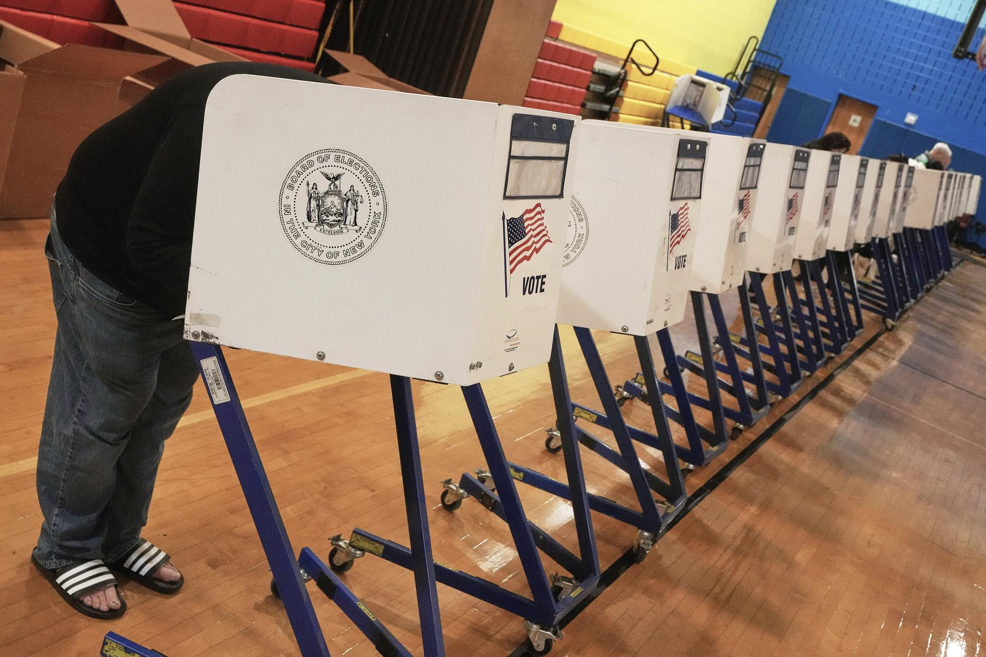 A voter completes their ballot at a voting site in New York on Tuesday. (AP Photo/Richard Drew)