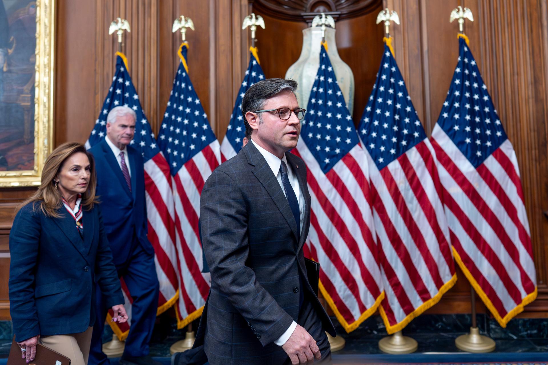 Speaker of the House Mike Johnson, R-La., center, joined from left by Rep. Lisa McClain, R-Mich., chair of the House Republican Conference, and House Majority Whip Tom Emmer, R-Minn., wrap up a news conference on day 23 of the government shutdown, at the Capitol in Washington on Thursday. (AP Photo/J. Scott Applewhite).