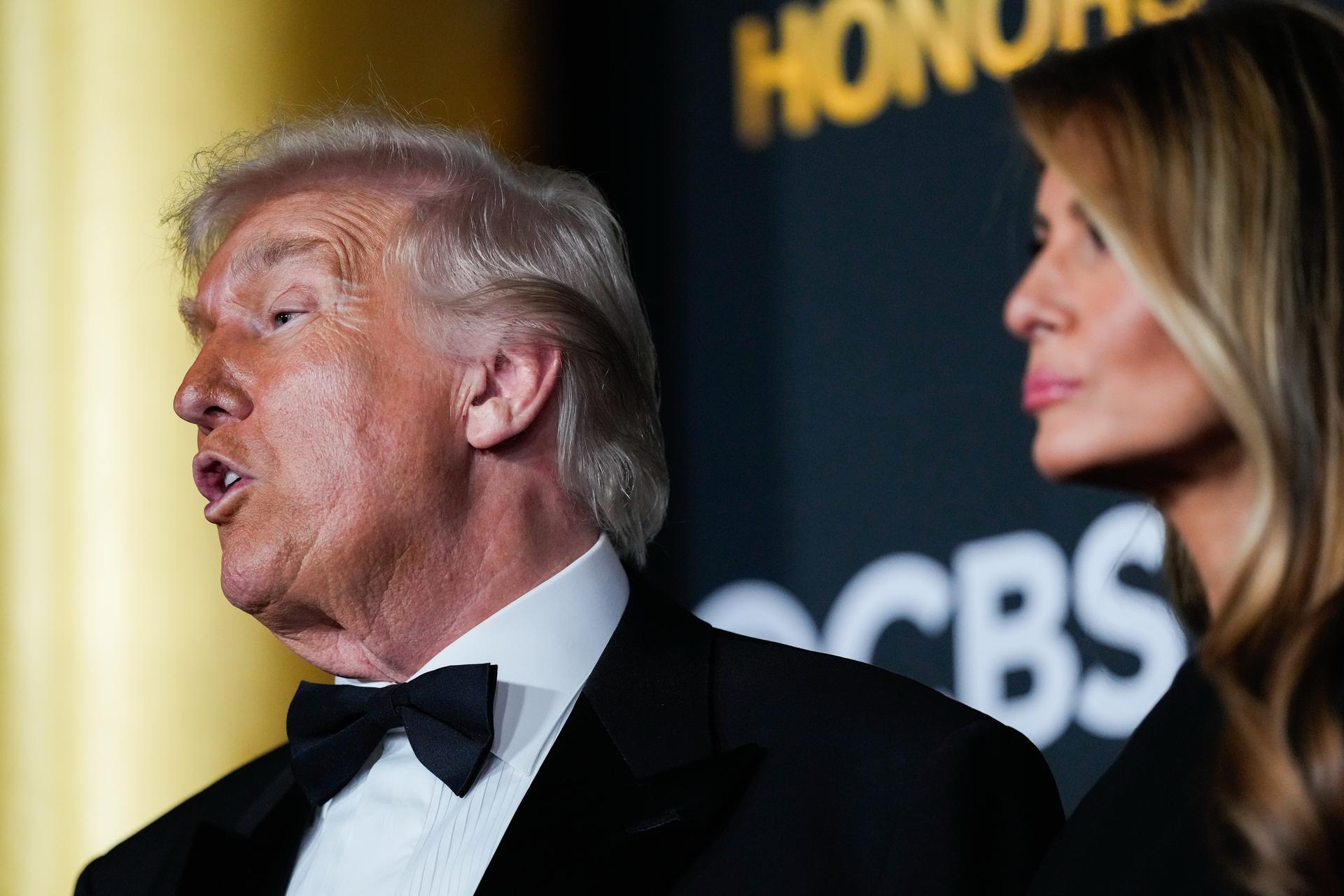 President Donald Trump and first lady Melania Trump walk the red carpet before the 48th Kennedy Center Honors, Sunday, at the John F. Kennedy Center for the Performing Arts in Washington.