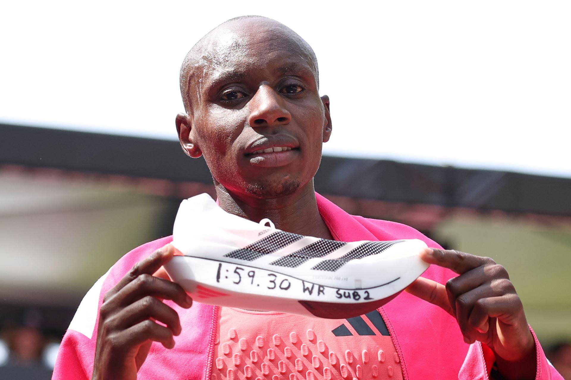 Sebastian Sawe from Kenya celebrates winning the men's race at the London Marathon on Sunday. (AP Photo/Ian Walton)