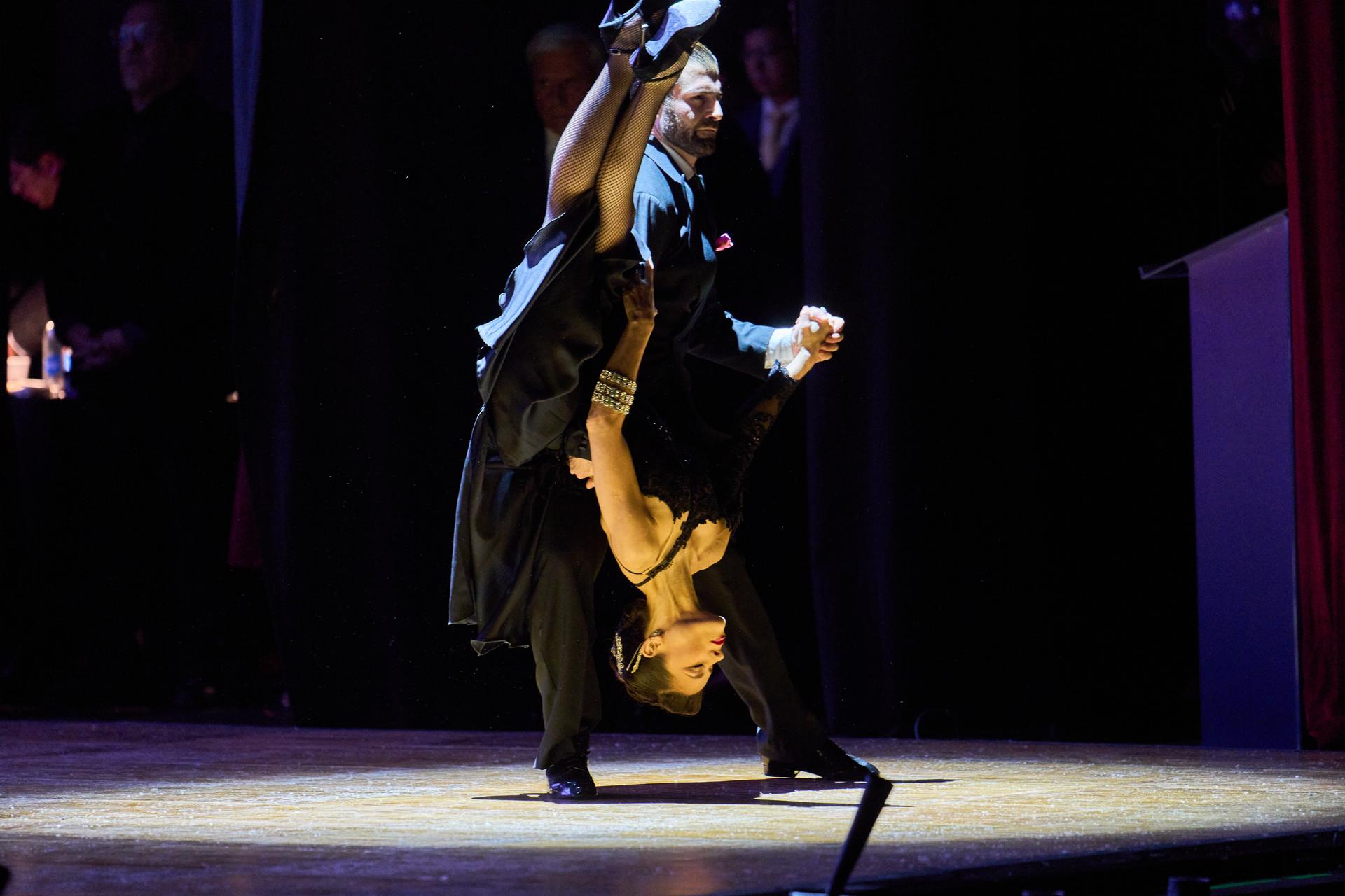 Dancers perform in a tango exhibition during the salon category competition at the Tango World Championship in Buenos Aires, Argentina, Tuesday.