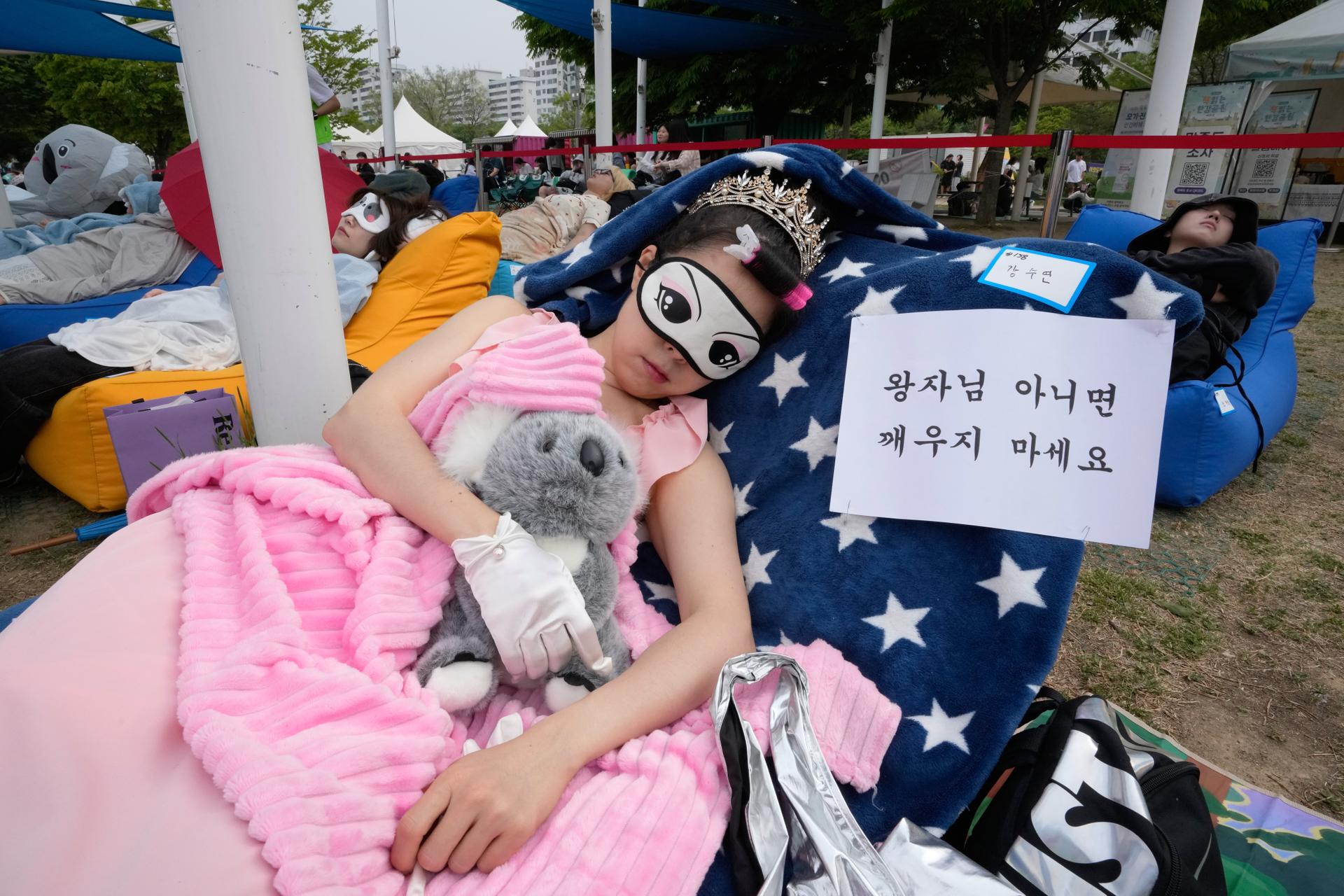 A participant on Saturday with a sign saying, “Don’t wake me up unless it’s a prince.”