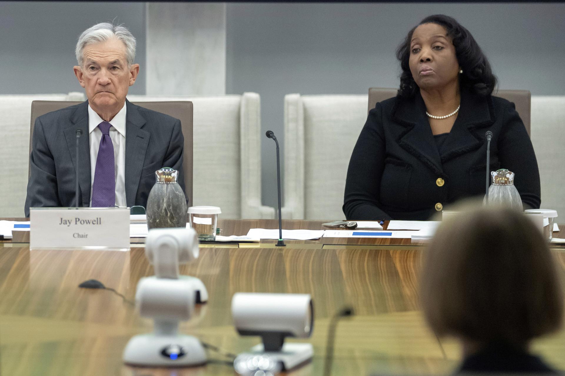 Federal Reserve Chairman Jerome Powell and Board of Governors member Lisa Cook, right, listen during a meeting at the Federal Reserve on June 25. (AP Photo/Mark Schiefelbein)