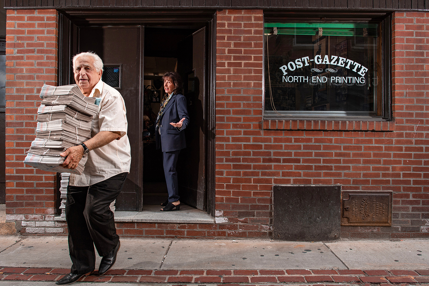 Ann Hermes’ photo shows Louie Graffeo delivering copies of The Post-Gazette for his girlfriend, publisher and editor, Pamela Donnaruma, in Boston in 2023.