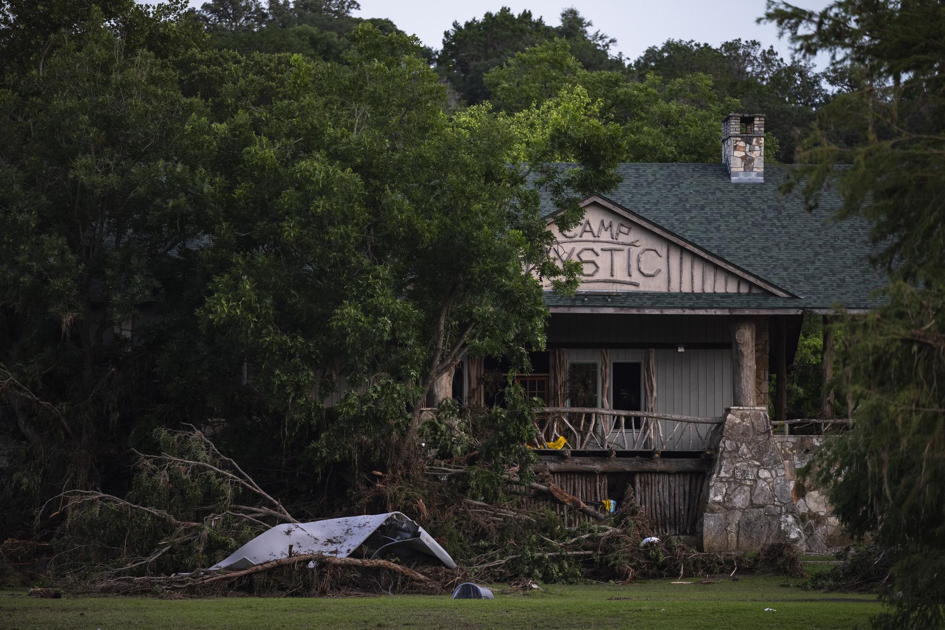 Debris covers the area of Camp Mystic in Hunt, Texas, Monday, July 7, 2025, after a flash flood swept through the area. (AP Photo/Eli Hartman)