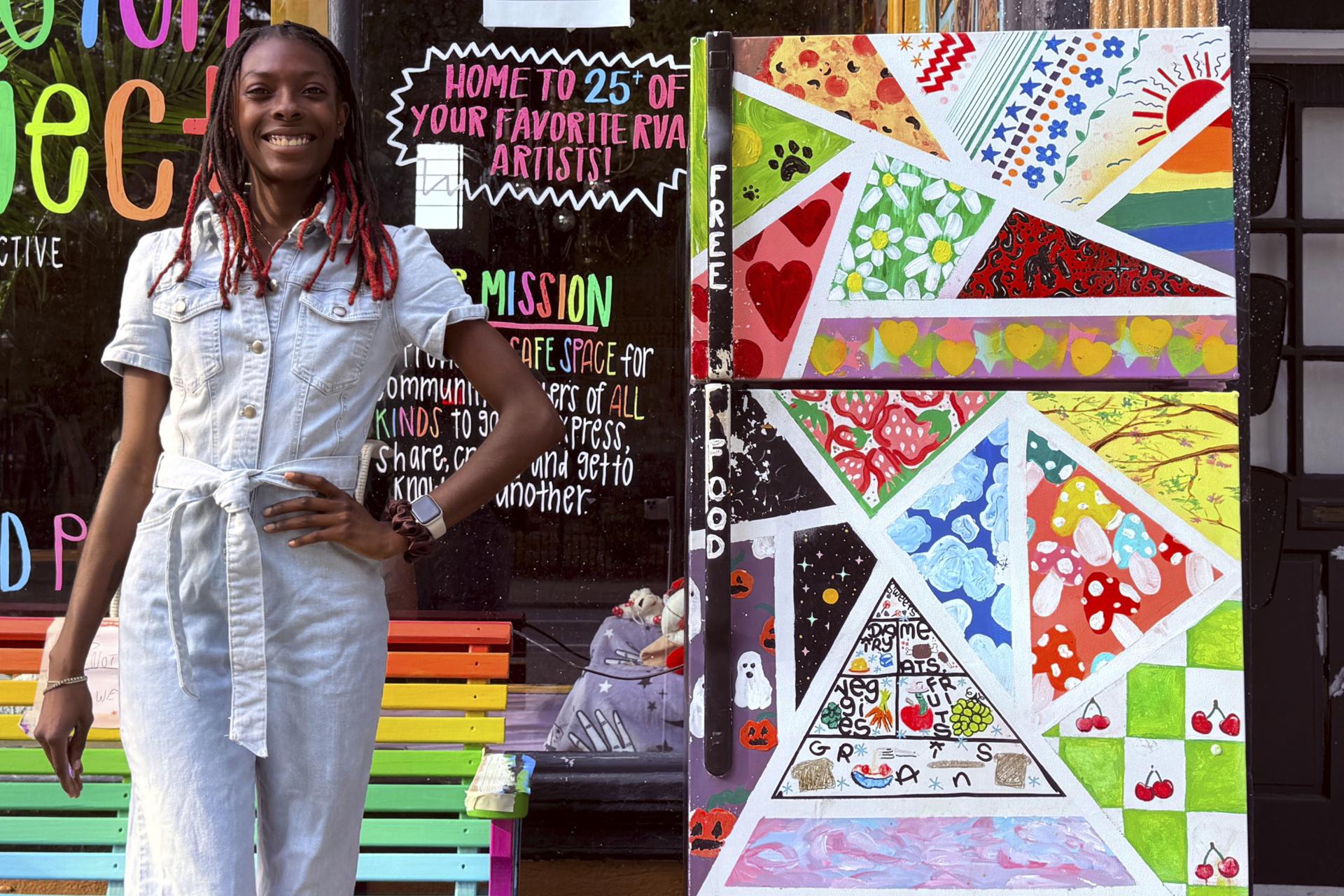 Taylor Scott, founder of RVA Community Fridges, poses with one of her fridges in Richmond on Sunday. (Taylor Scott/RVA Community Fridges via AP)