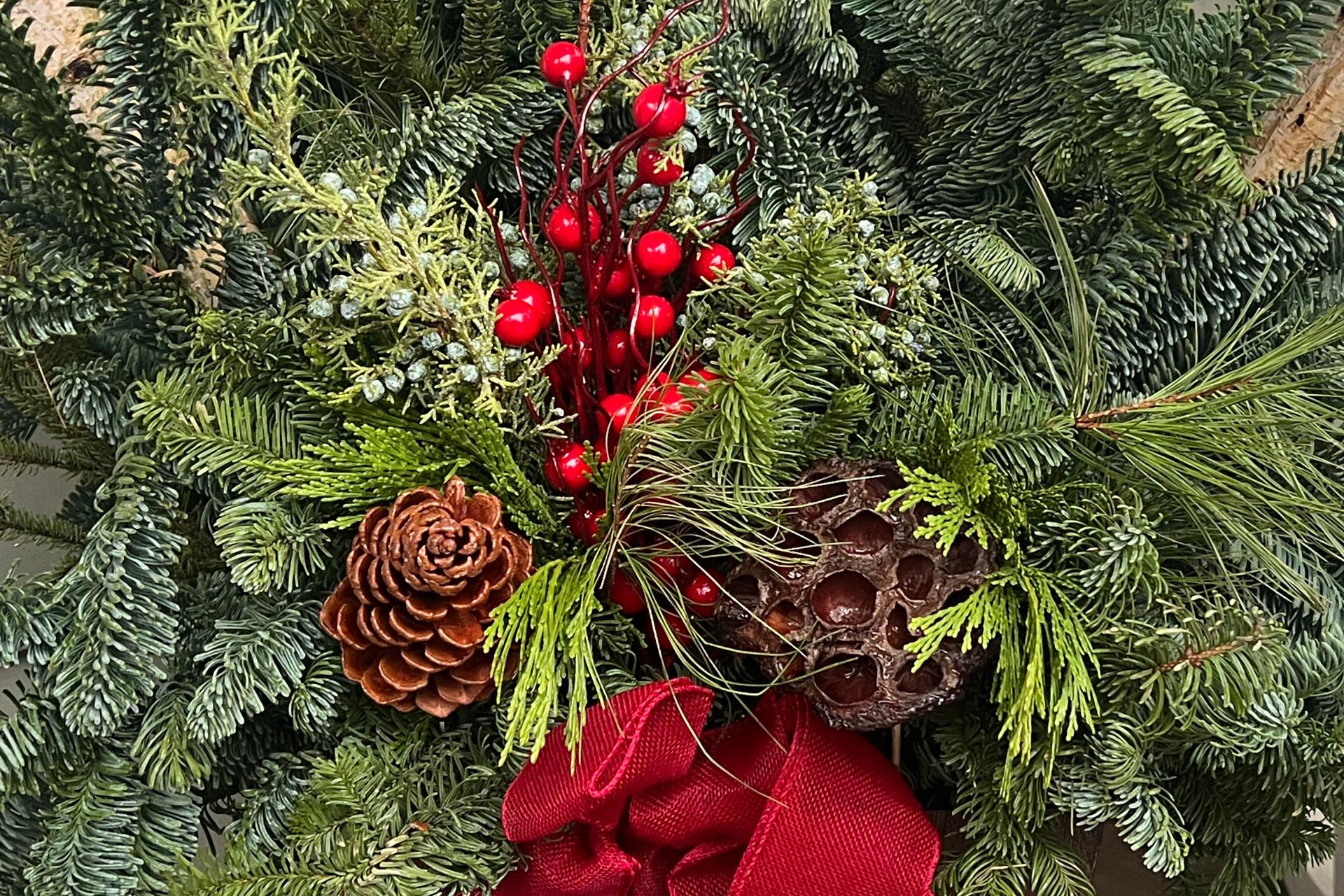 A holiday arrangement made of various greenery is displayed at a home on Long Island, N.Y., on Dec. 2. (Jessica Damiano via AP)
