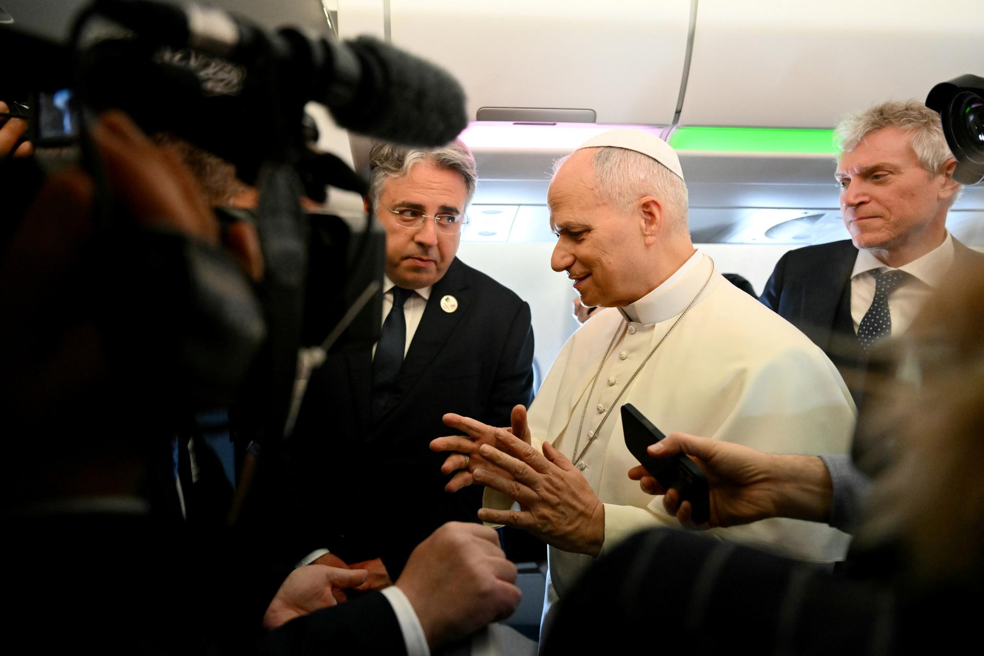 Pope Leo XIV speaks to journalists aboard his flight on Monday, at the start of an 11-day apostolic journey to Africa. 