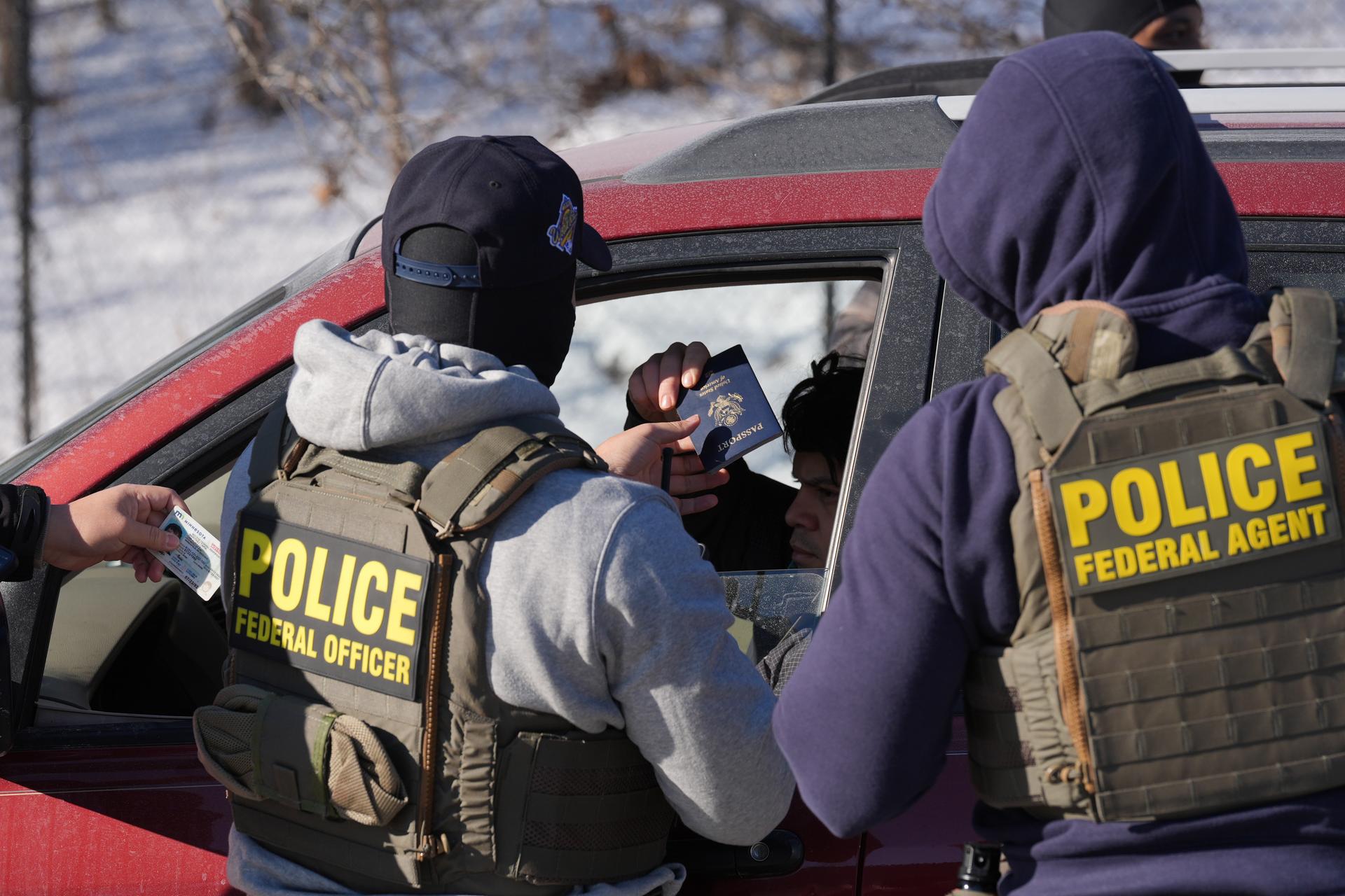 Federal agents make a traffic stop in Minneapolis on Tuesday. (AP Photo/Adam Gray)