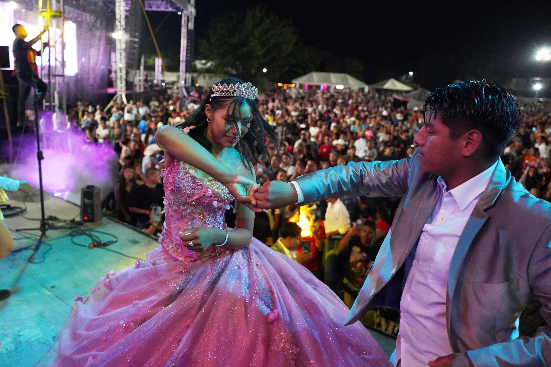 Isela Anali Santiago Morales dances during her 15th birthday party at a stadium in Axtla de Terrazas, Mexico, on Saturday. (AP Photo/Mauricio Palos)