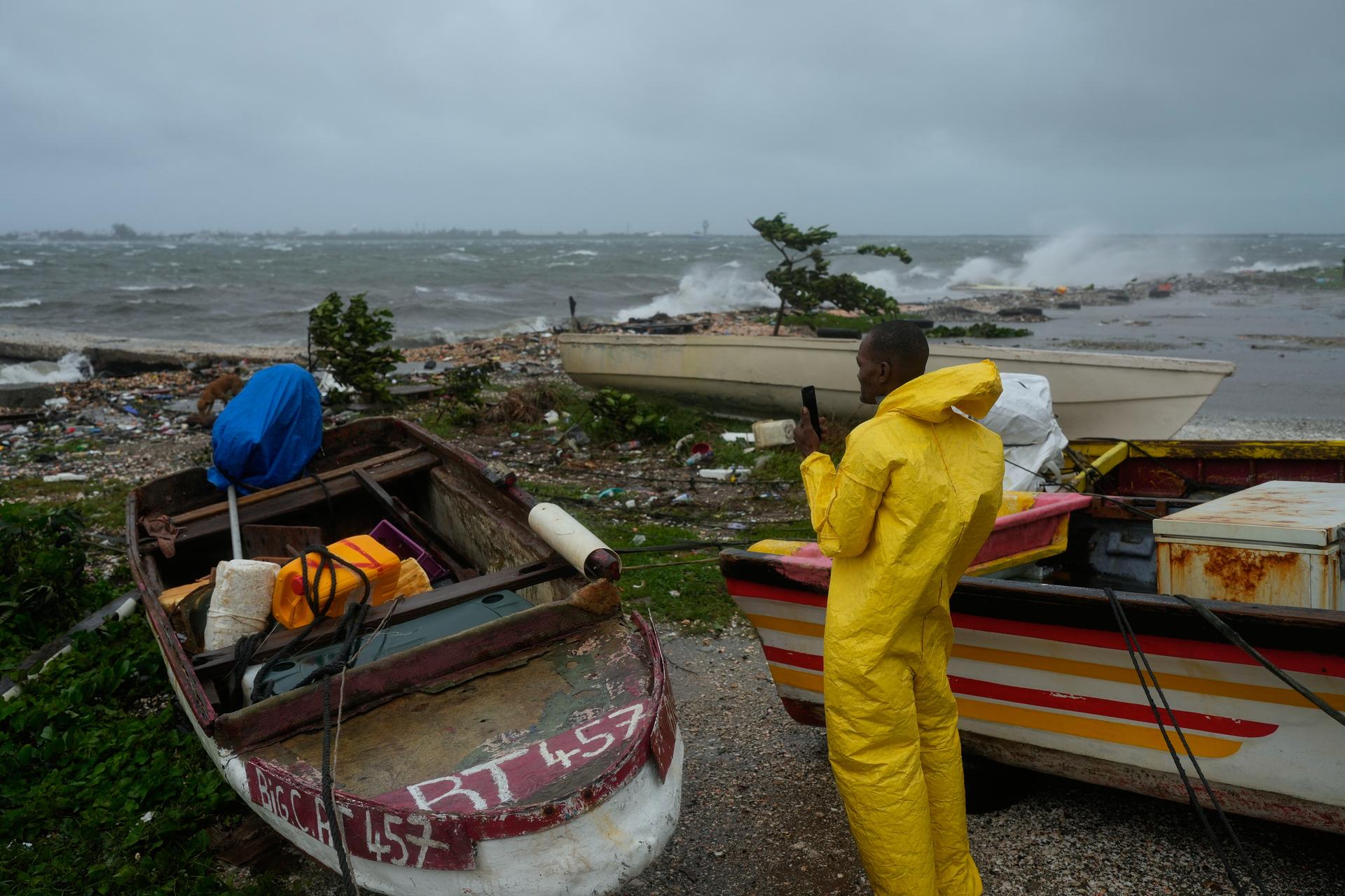 A man watches the coastline in Kingston, Jamaica, as Hurricane Melissa closes in on Tuesday. (AP Photo/Matias Delacroix).
