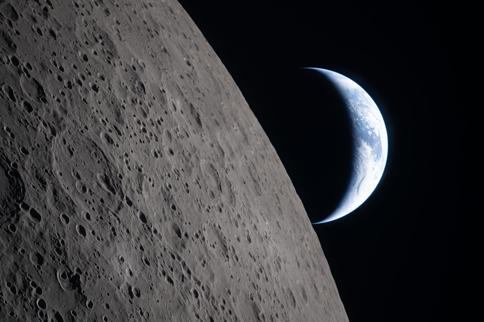 The Artemis II crew captured this view as the Earth sets behind the Moon during a lunar flyby, Monday.