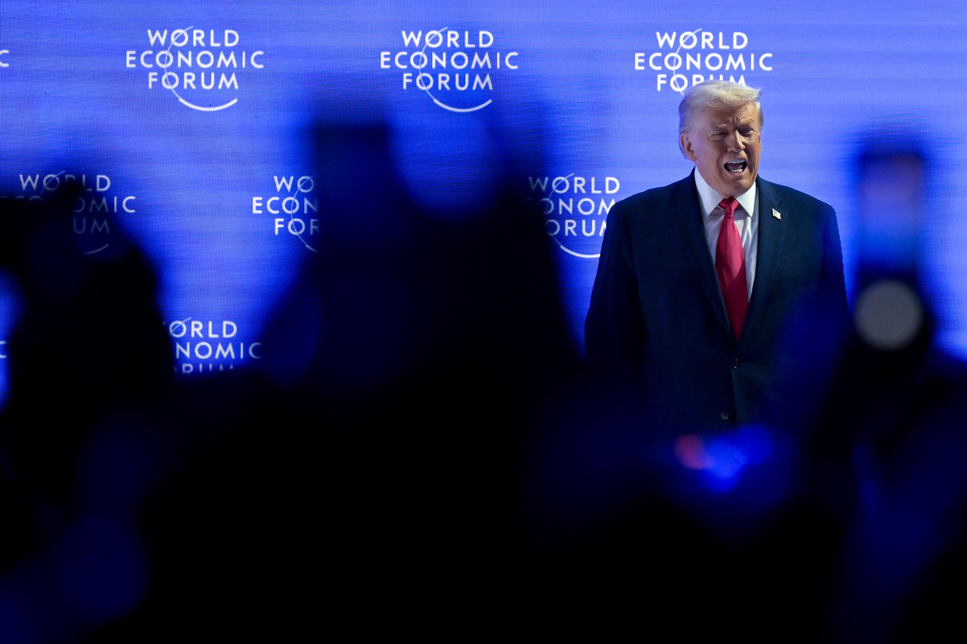 President Donald Trump walks on to the stage during the 56th annual meeting of the World Economic Forum in Davos, Switzerland, on Wednesday. (Gian Ehrenzeller/Keystone via AP)