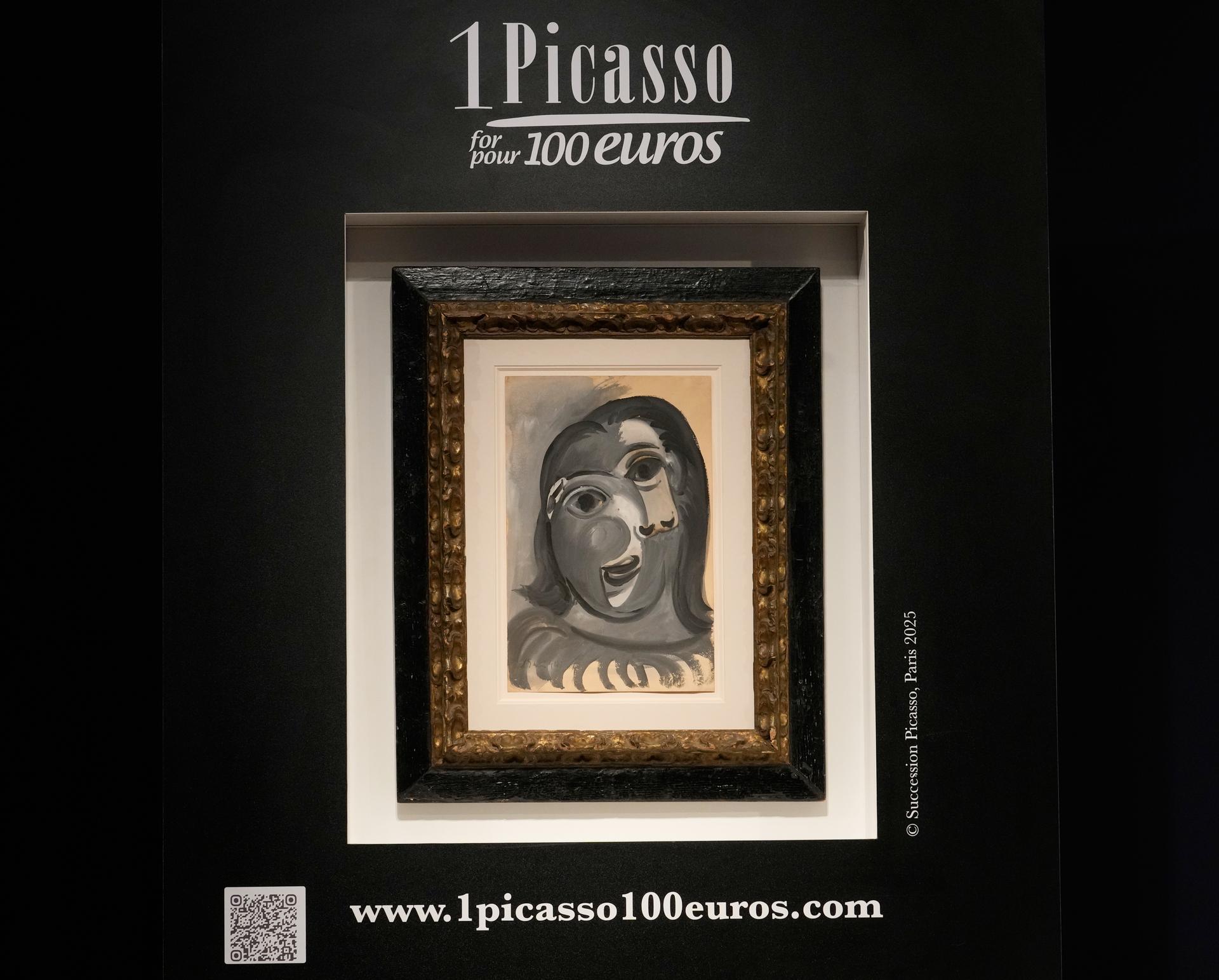 The painting 'Head of a Woman' by Pablo Picasso, painted in 1941, is presented prior to the raffle draw at the auction house Christie's in Paris on Tuesday. 