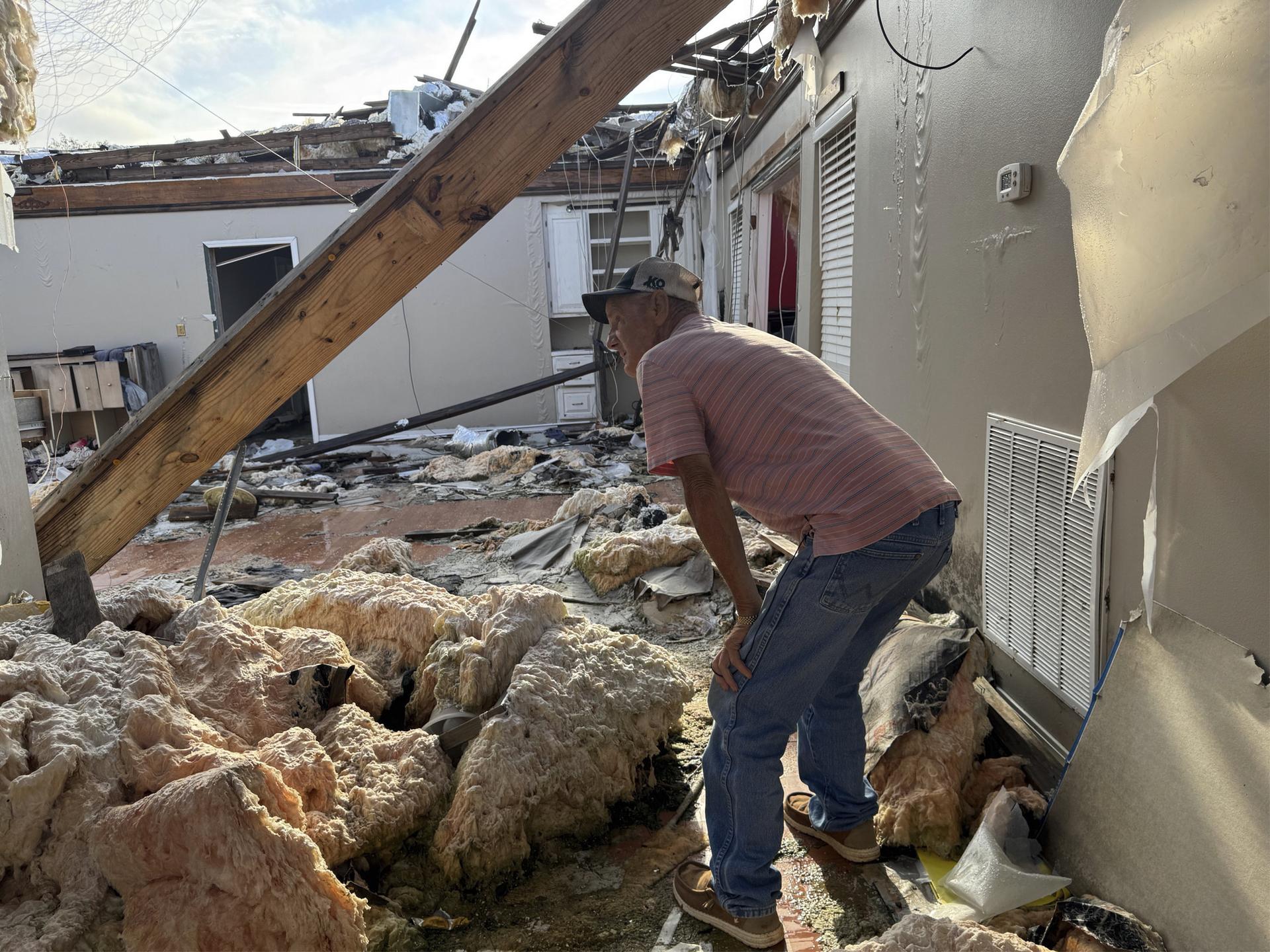 Buddy Anthony surveys the remnants of his home in Tylertown, Miss., on Aug. 14. (AP Photo/Sophie Bates)