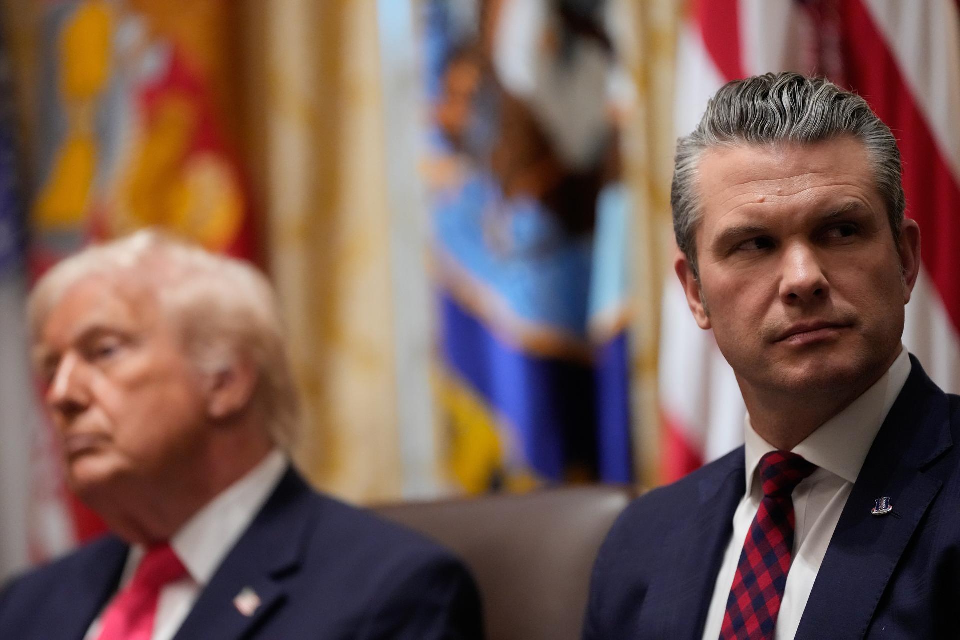 President Donald Trump and Defense Secretary Pete Hegseth attend a Cabinet meeting at the White House, Tuesday, in Washington.
