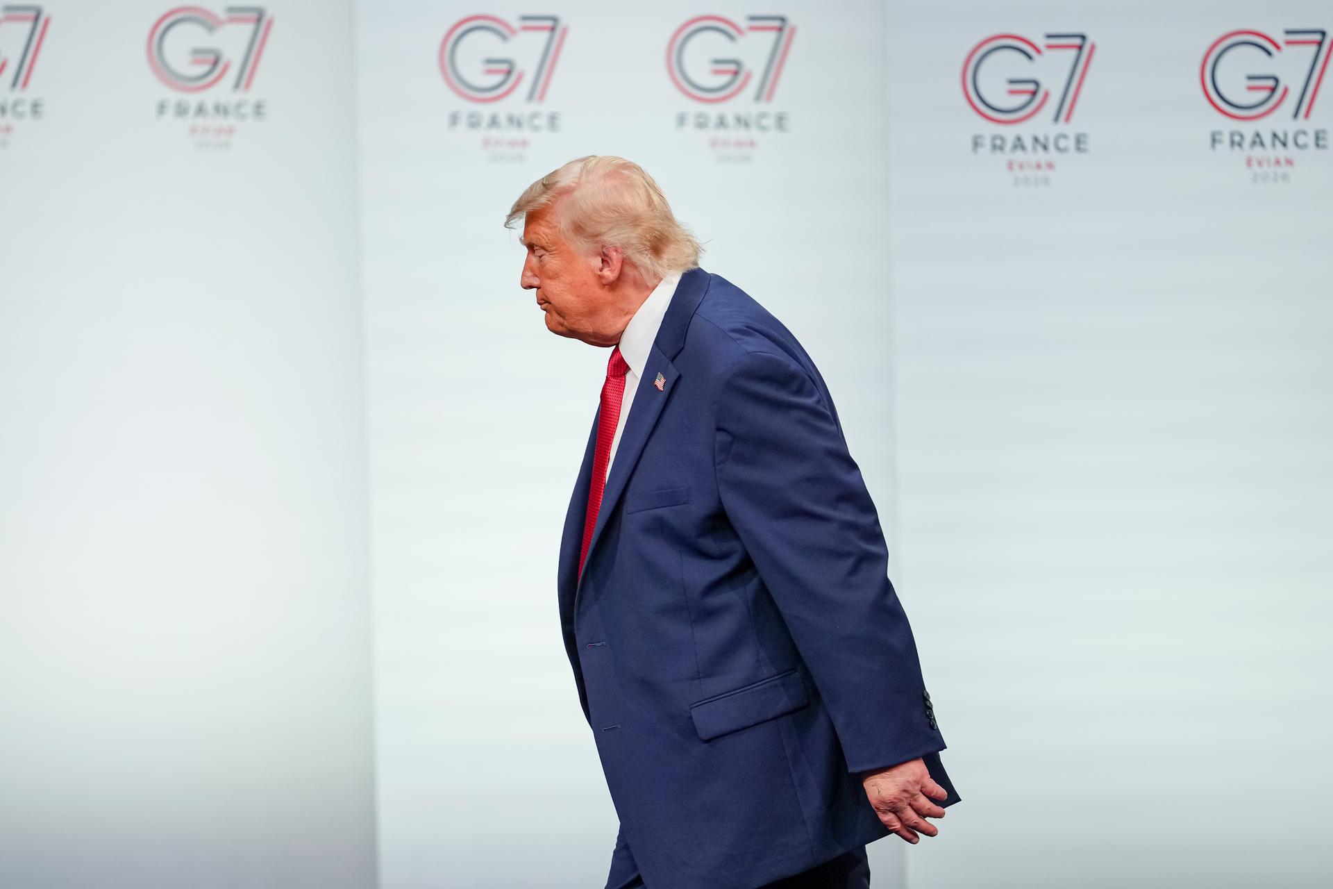 President Donald Trump leaves the stage after a media conference at the end of the G7 summit in Evian-les-Bains, France, Wednesday. 