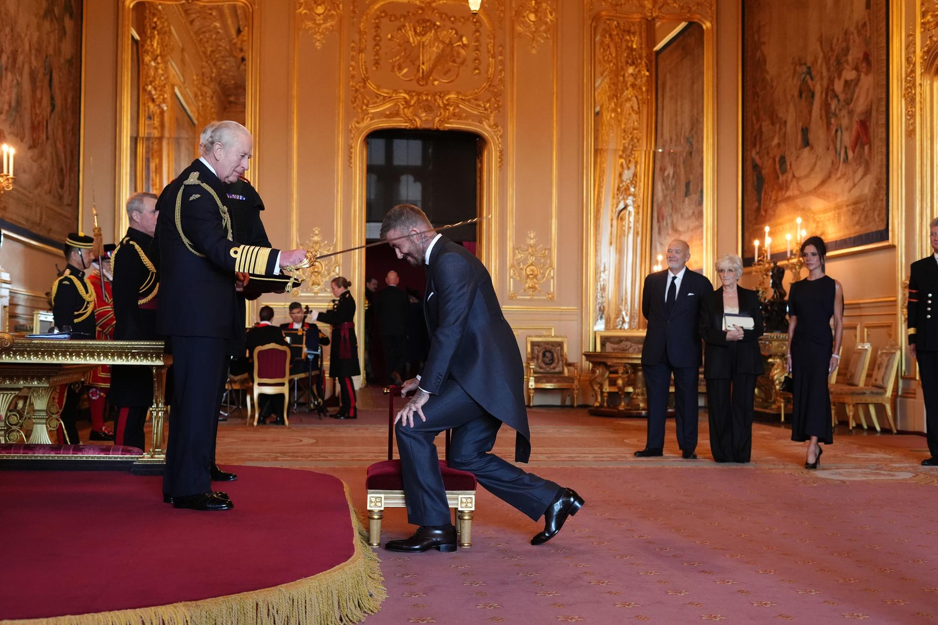 Sir David Beckham is made a Knight Bachelor by Britain's King Charles III on Tuesday. (Jonathan Brady/PA via AP)