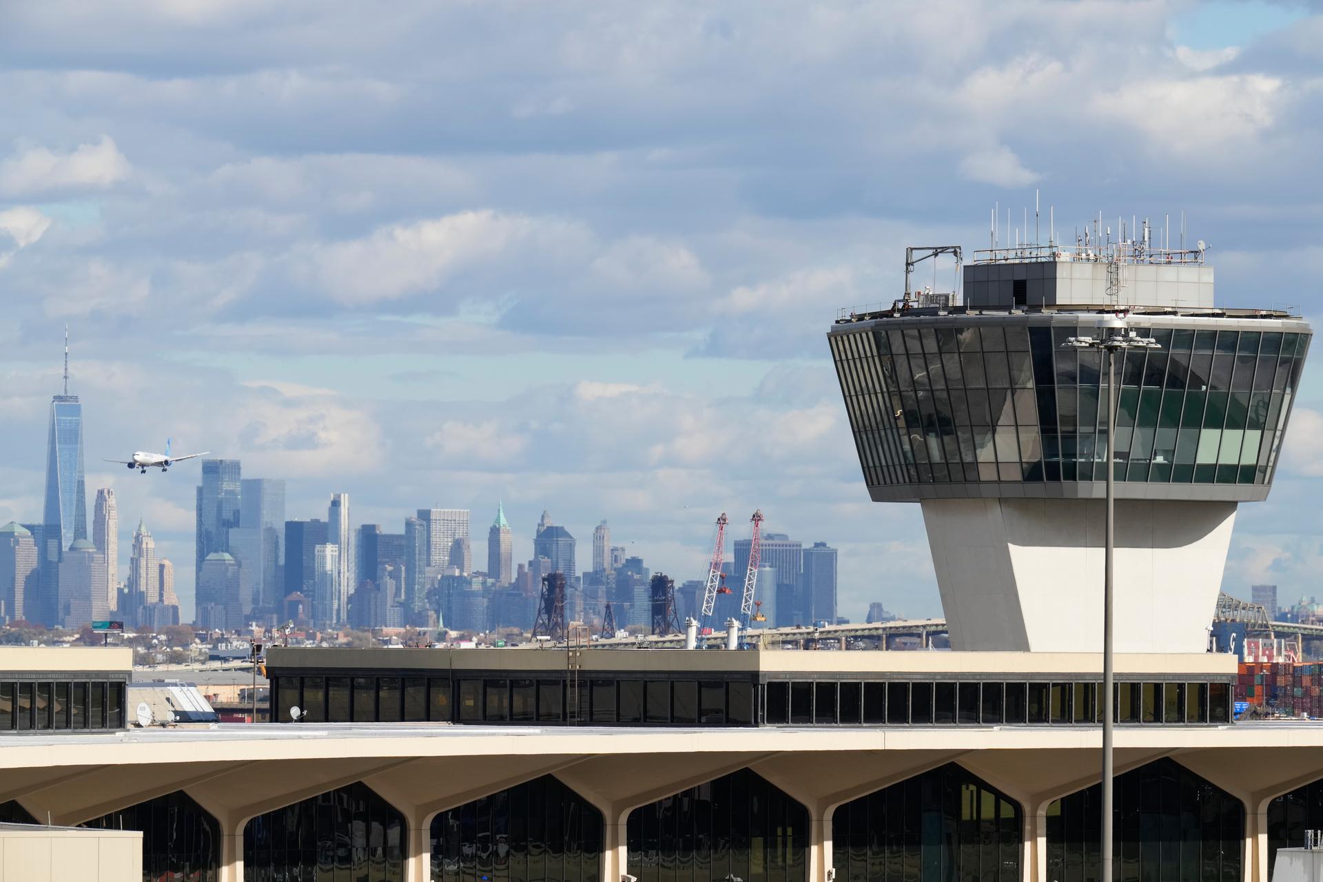 The New York City skyline is seen behind an air traffic control tower at Newark International Airport on Thursday. (AP Photo/Seth Wenig)