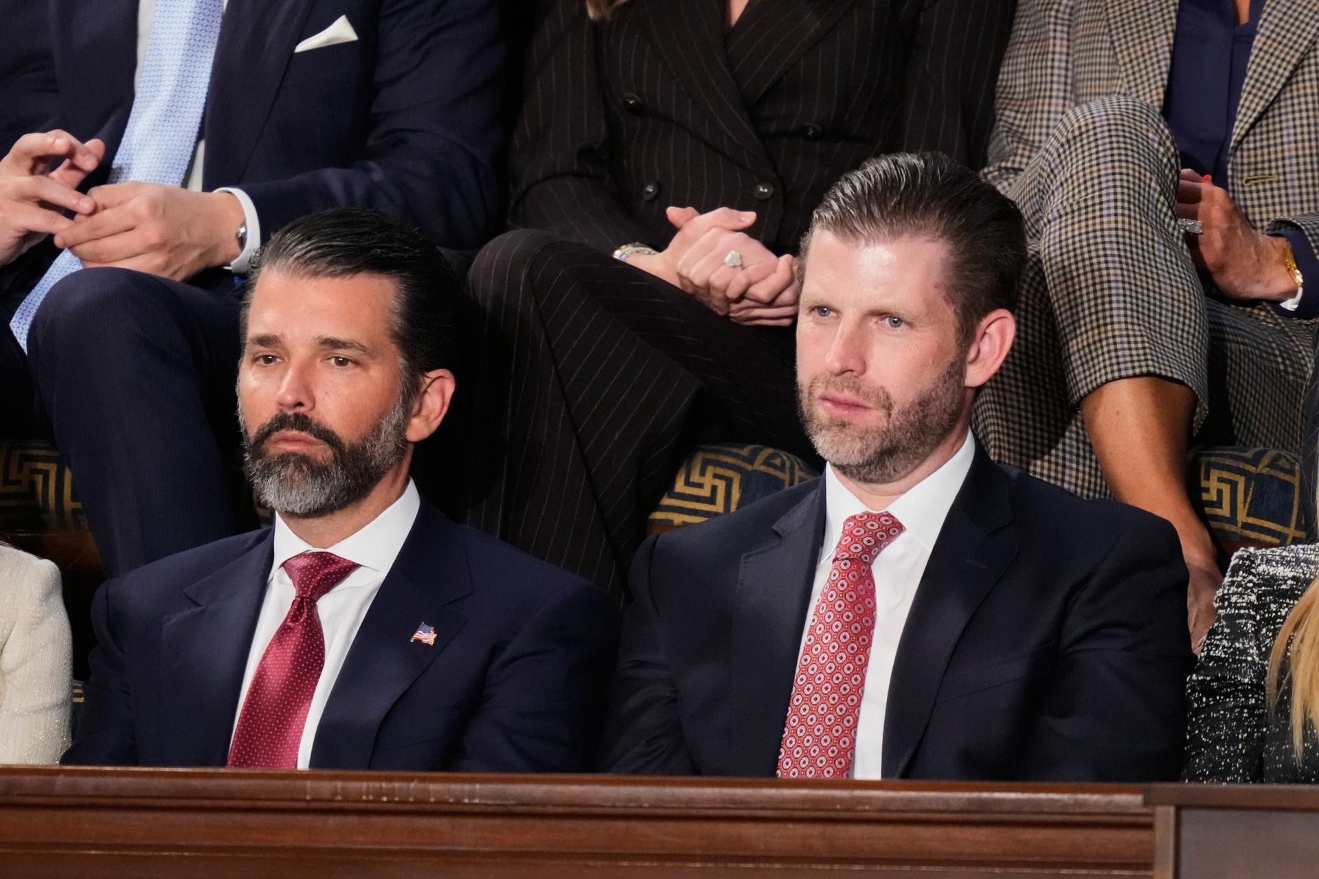 Donald Trump Jr. and Eric Trump listen to President Donald Trump’s State of the Union address in the House chamber at the U.S. Capitol in Washington, Feb. 24. 