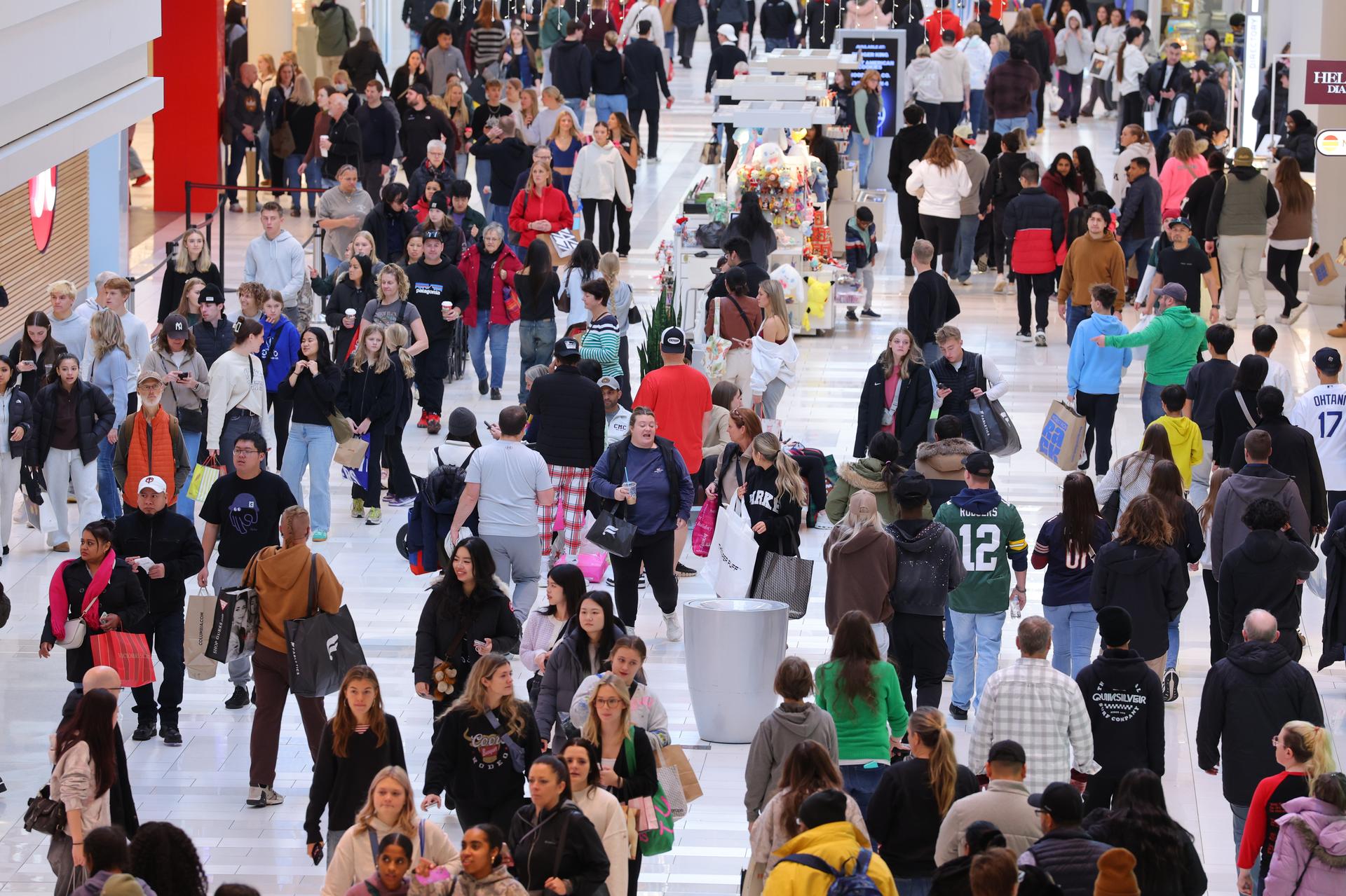 Shoppers browse through stores at Mall of America for Black Friday deals on Nov. 28. (AP Photo/Adam Bettcher)