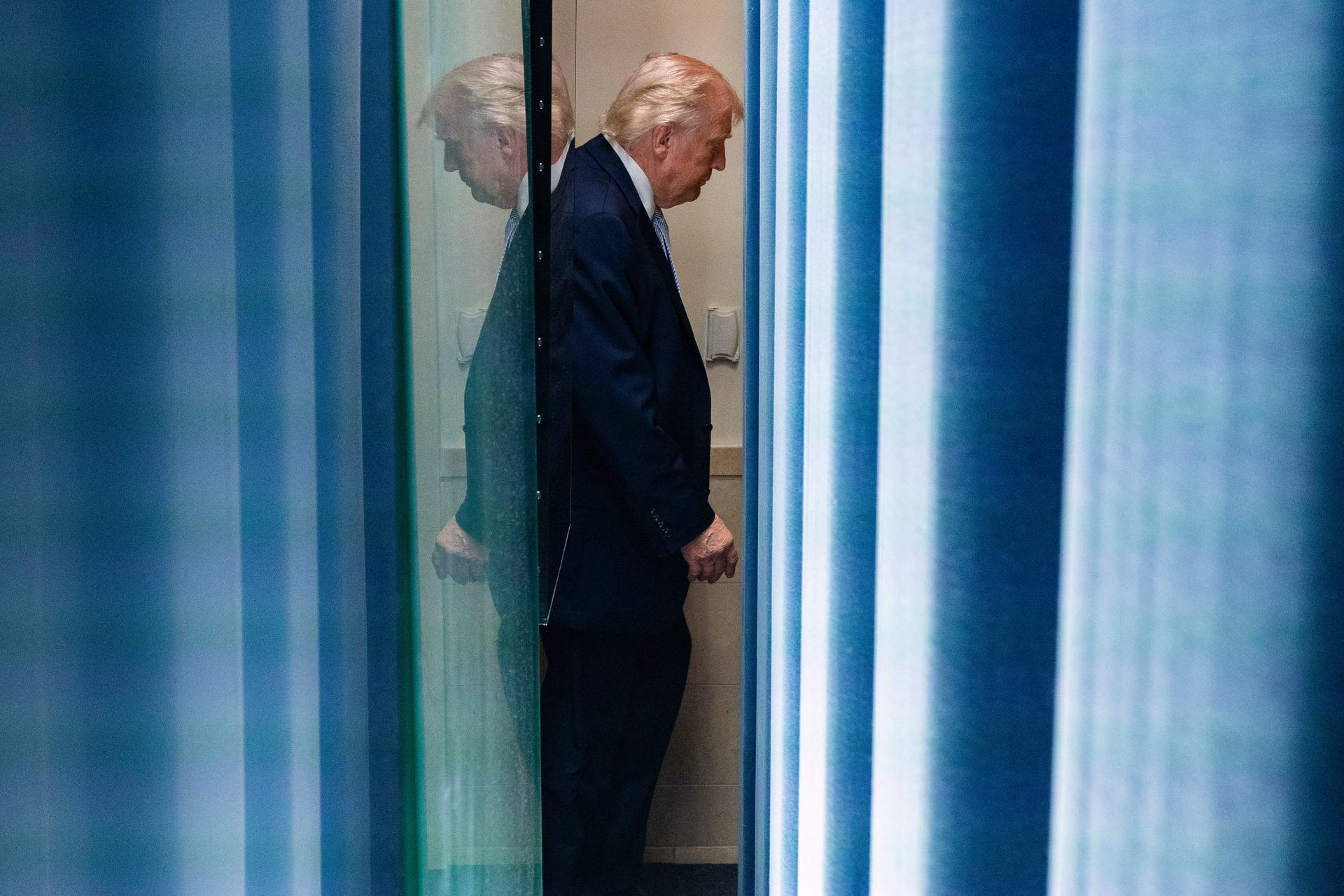 President Donald Trump departs after speaking with reporters in the James Brady Press Briefing Room at the White House, Monday, in Washington.