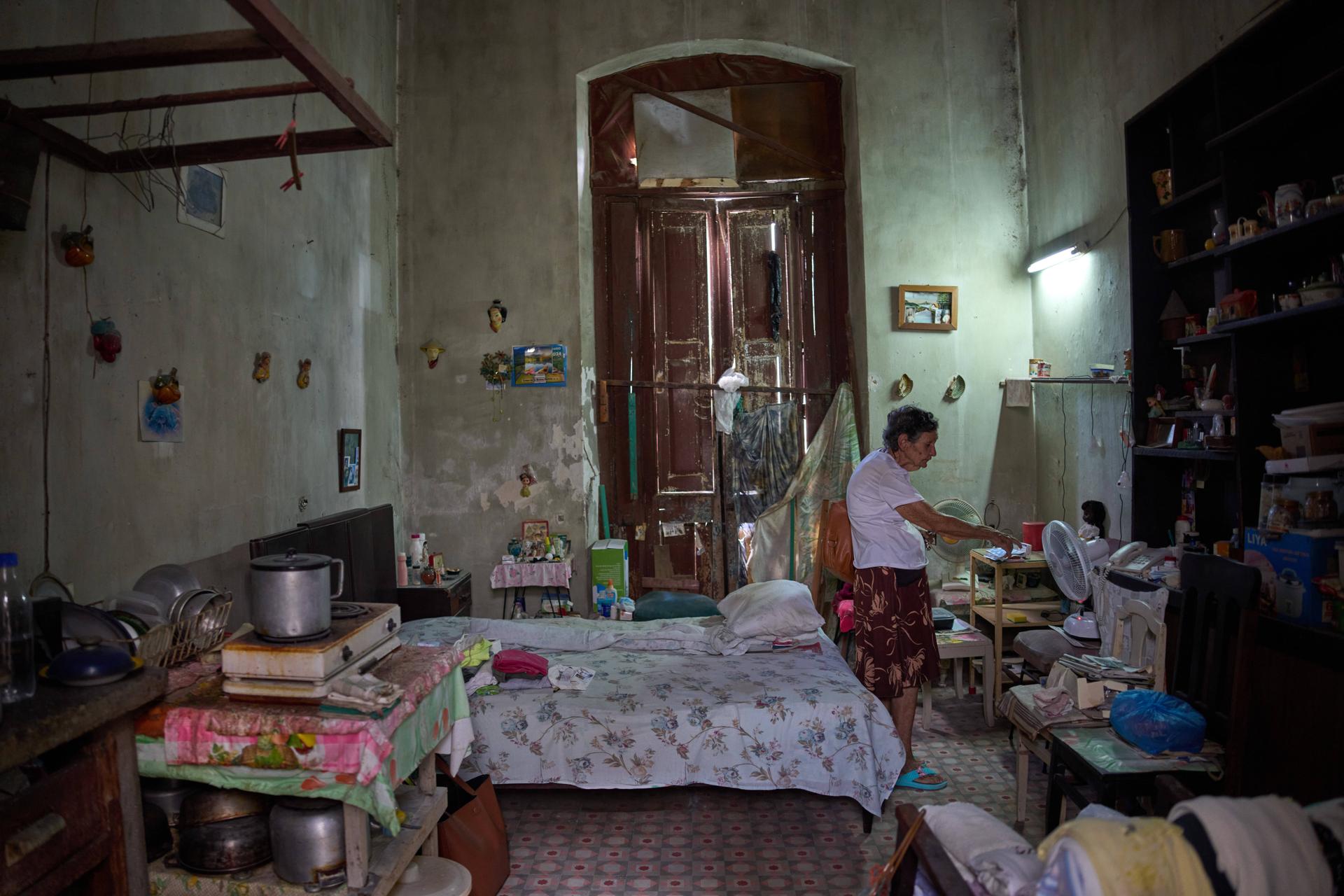 Mercedes Lopez Rey, 83, stands in her one-room apartment in Old Havana, Cuba, on April 10. (AP Photo/Ramon Espinosa)