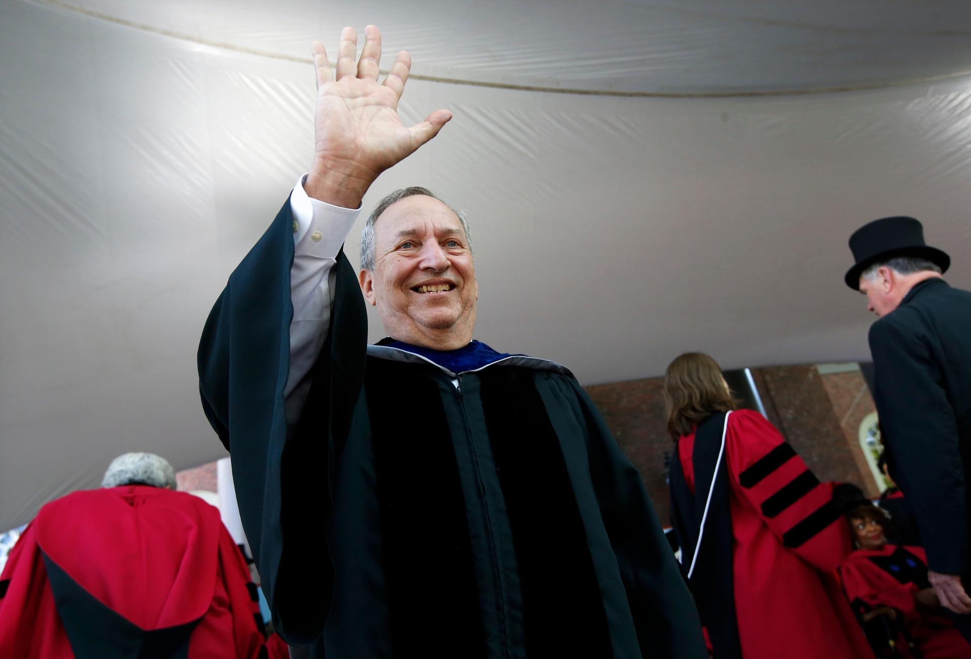 FILE -Former Harvard University president Larry Summers waves during Harvard commencement exercises, May 24, 2018, in Cambridge, Mass.