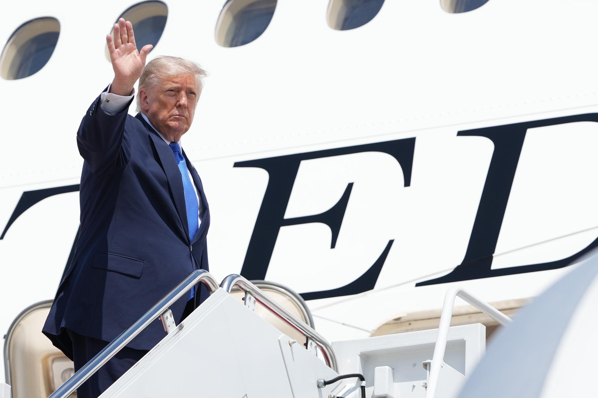 President Donald Trump boards Air Force One, Aug. 4, at Joint Base Andrews, Md.