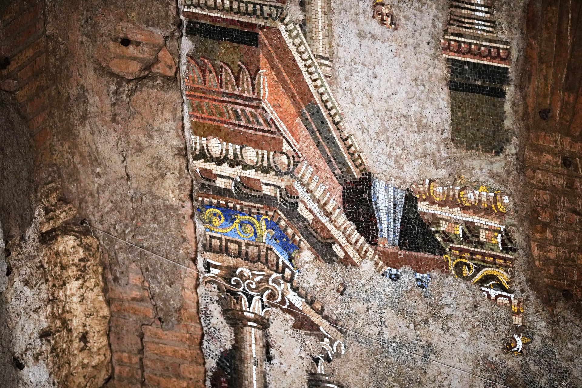 A section of the restored ancient wall mosaic from the “Painted City” site is seen in Rome on Sept. 8.