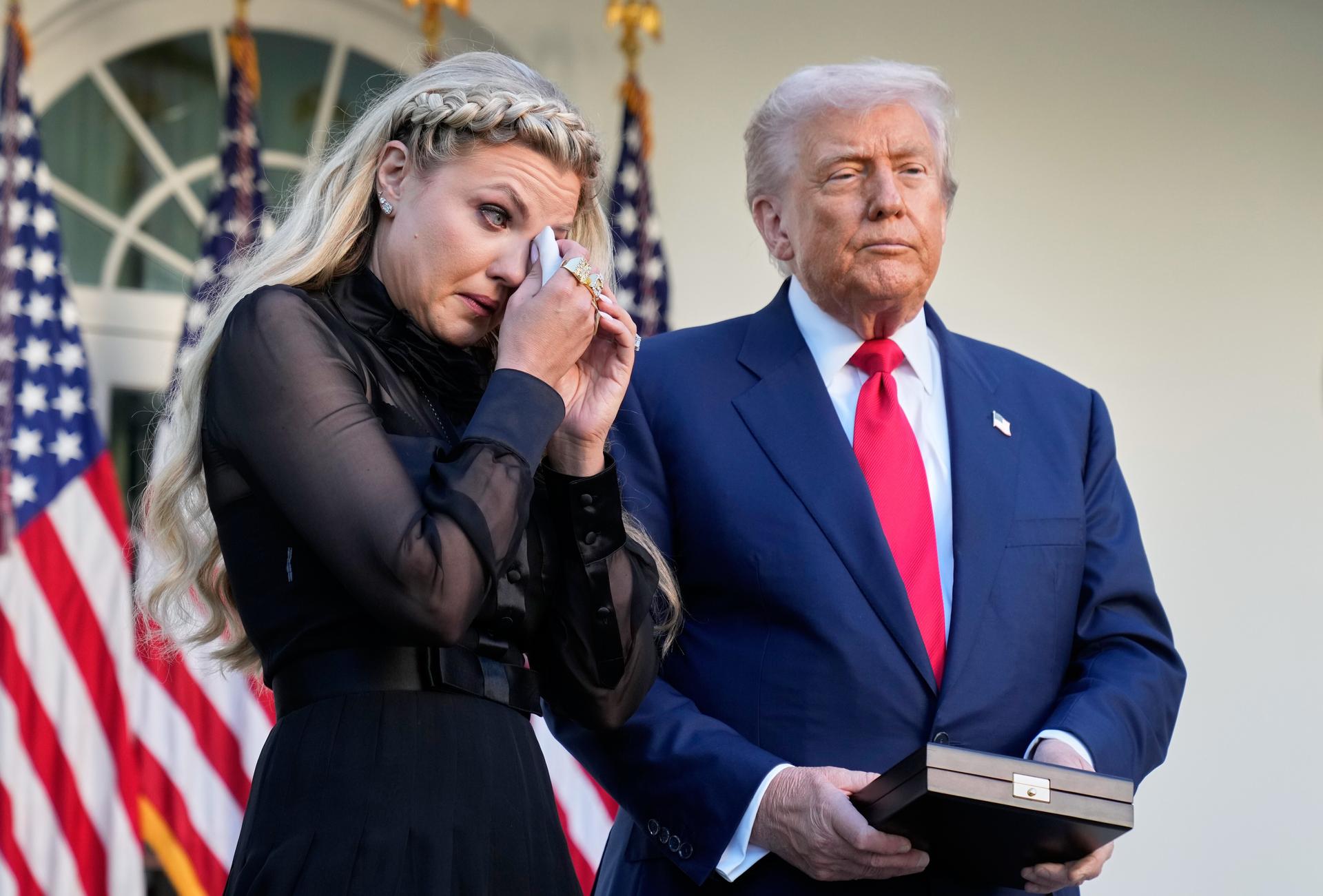 Erika Kirk wipes her eyes before President Donald Trump posthumously awards the Presidential Medal of Freedom to her late husband, Charlie Kirk, in the Rose Garden of the White House, Tuesday, in Washington. 