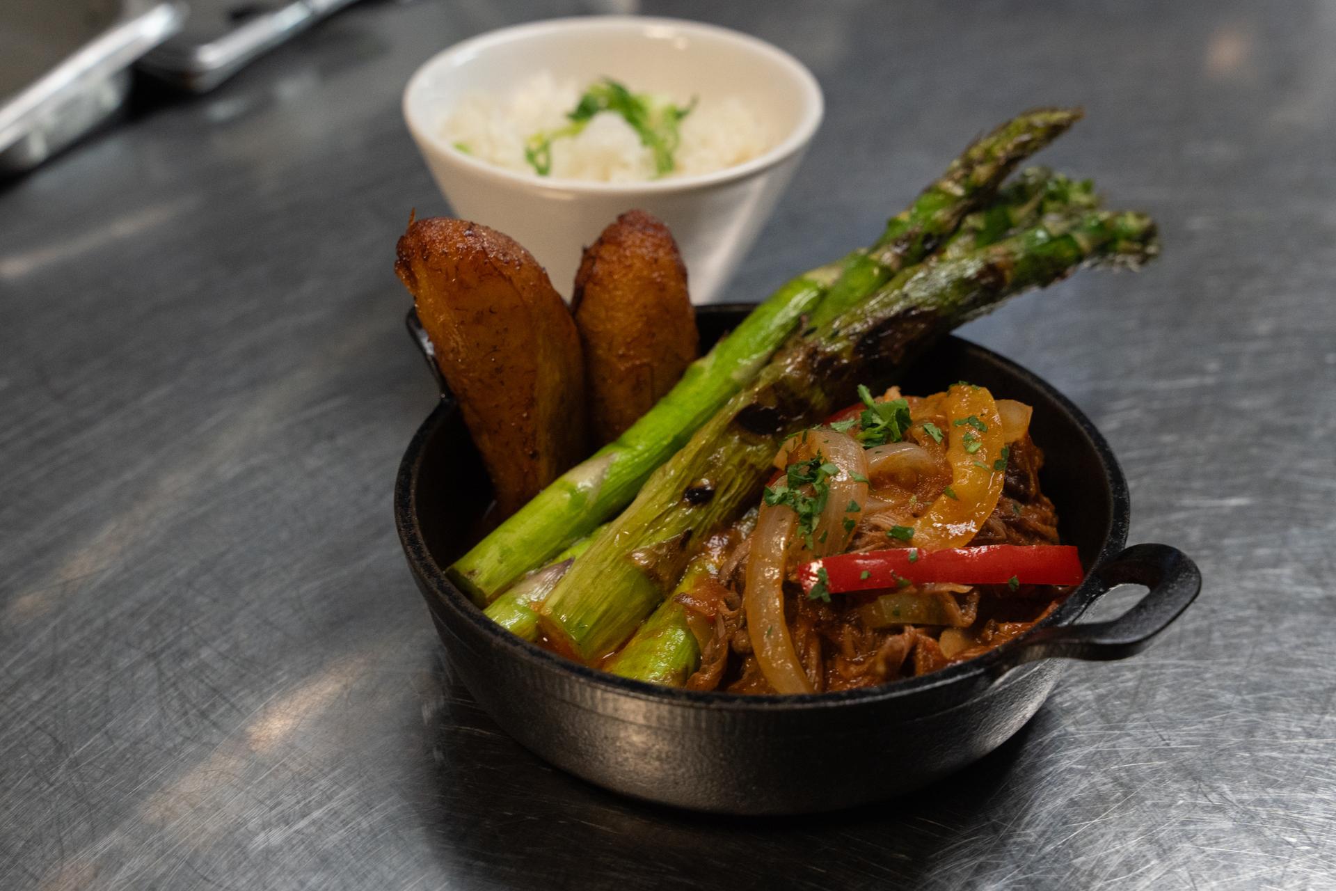 A ropa vieja dish from Cuba Libre Restaurant and Rum Bar's GLP-Wonderful menu is prepared for serving at the restaurant in Philadelphia, on Friday, March 6, 2026. (AP Photo/Mingson Lau).