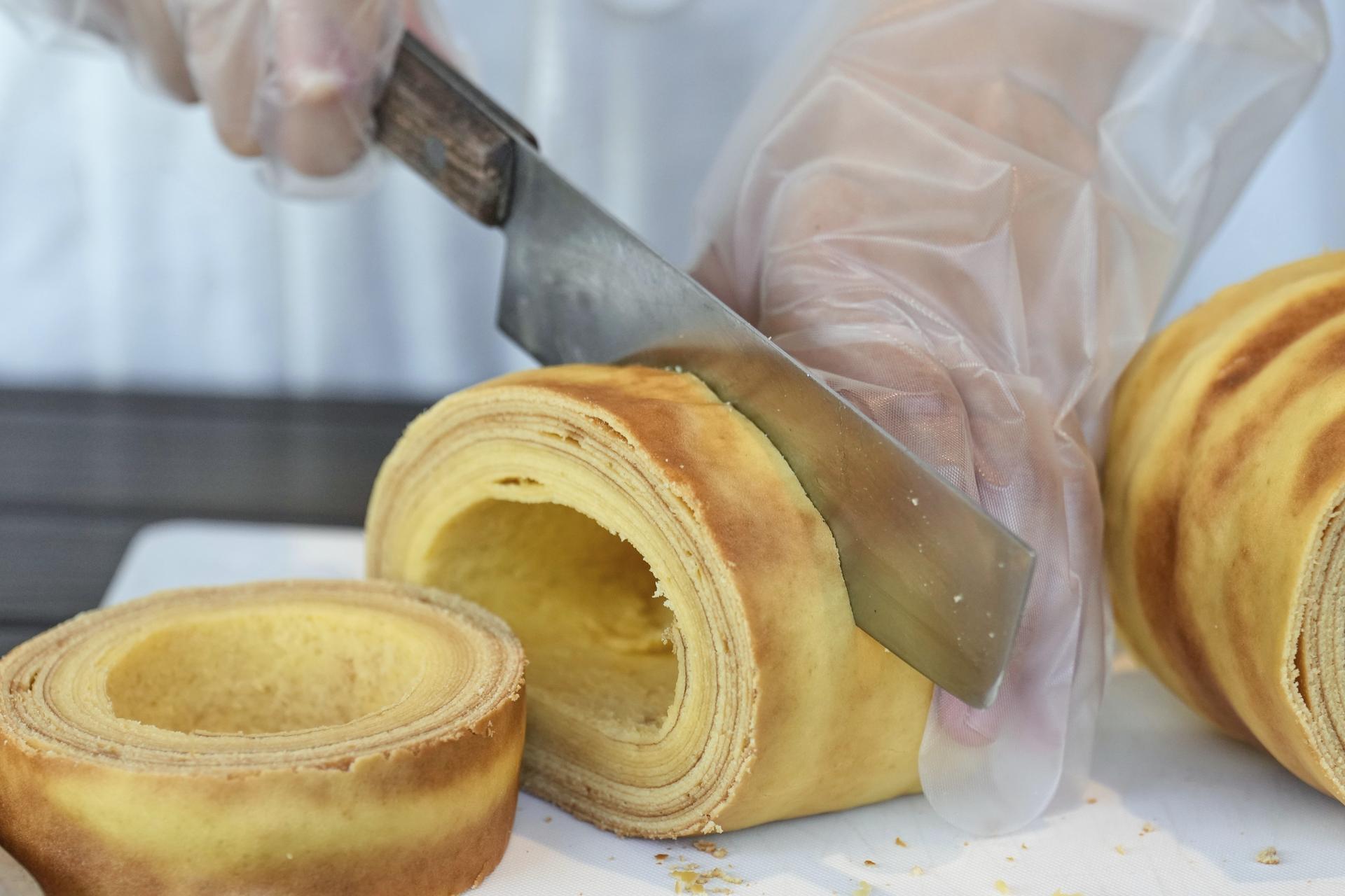 Baumkuchen, a German layered cake, is cut during a workshop in Hiroshima, western Japan, in July. (AP Photo/Eugene Hoshiko)