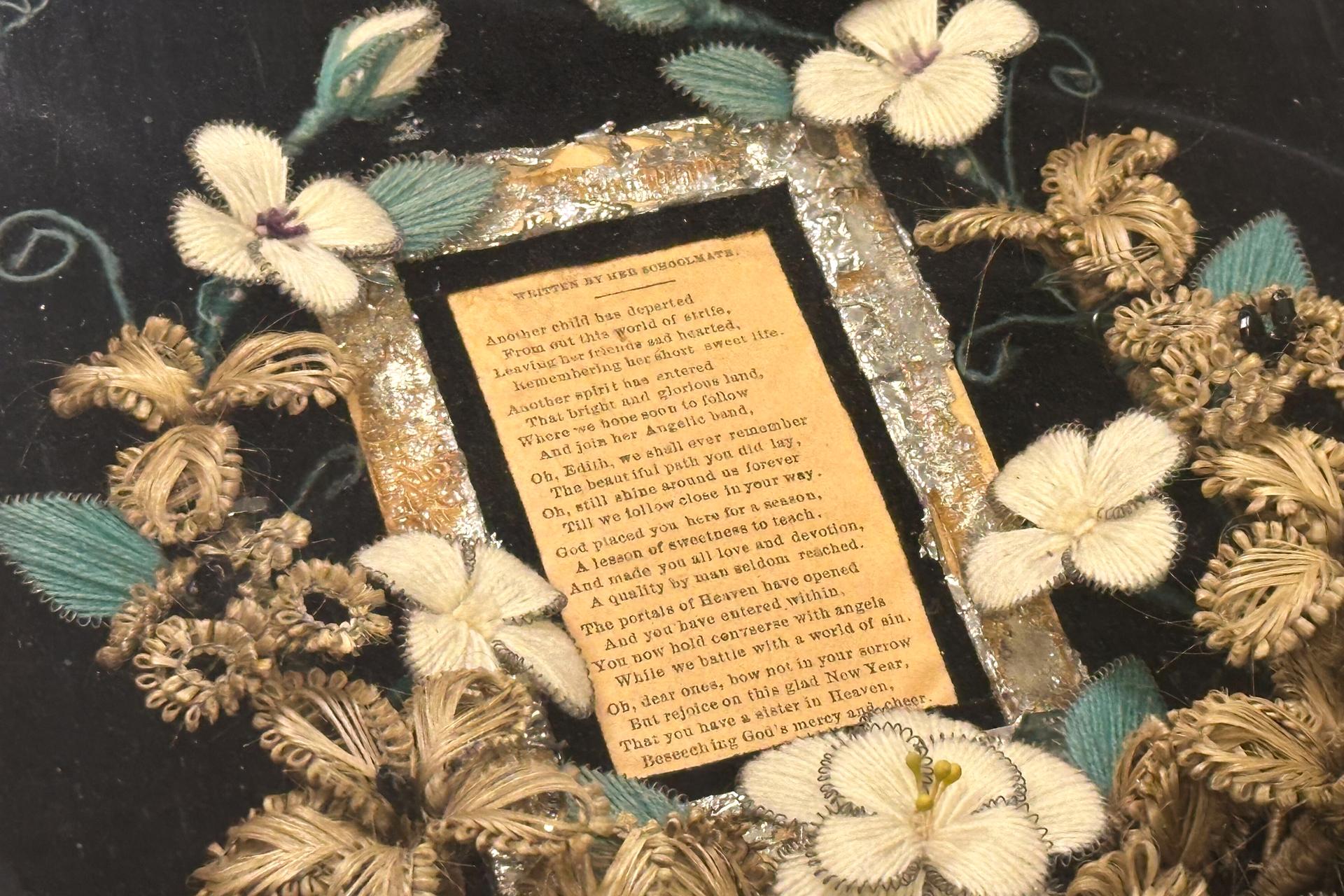 A wreath of human hair encircling a poem about a young girl who died is on display Monday at Leila's Hair Museum. (AP Photo/Nick Ingram)