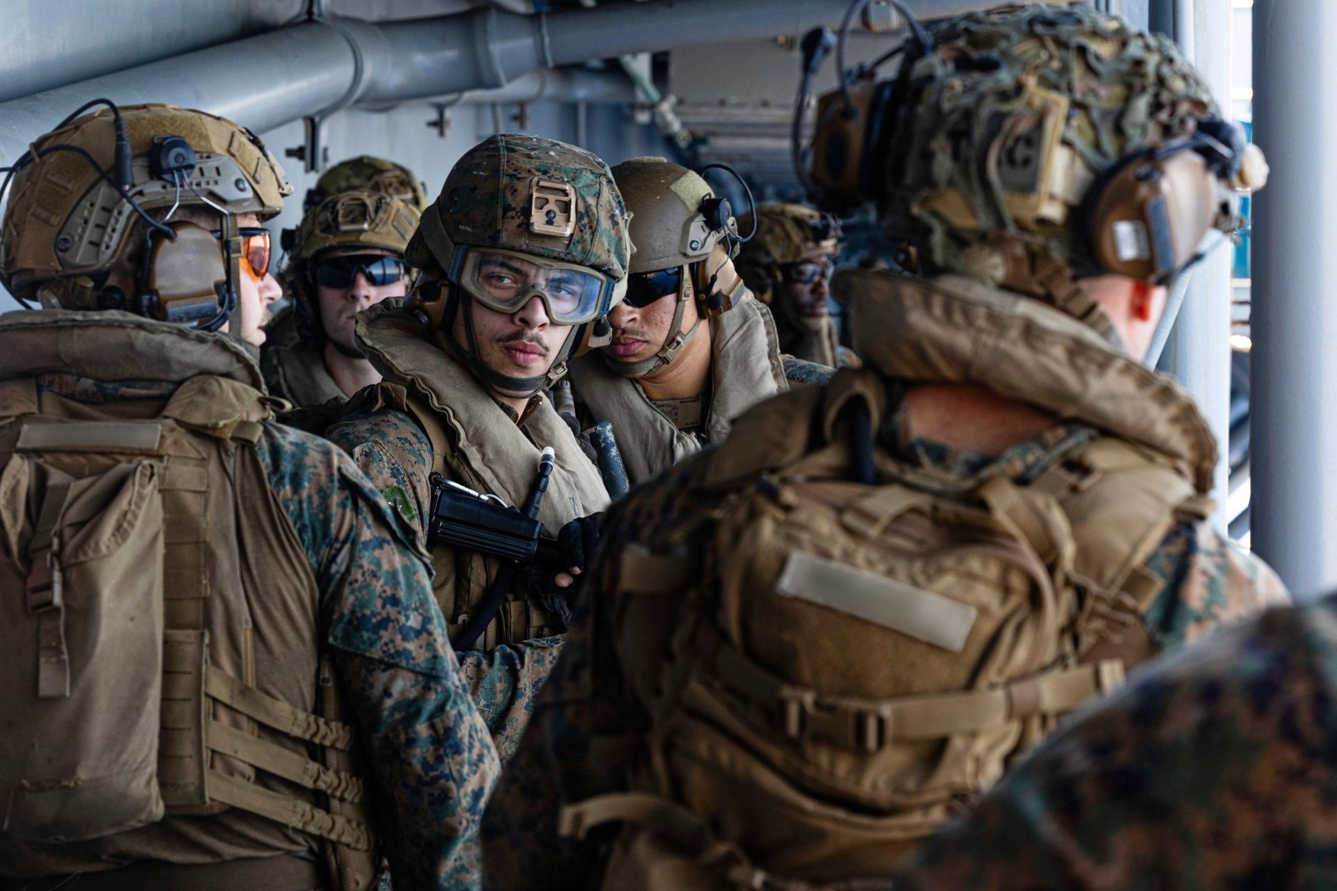U.S. Sailors and Marines aboard USS Tripoli arriving in the U.S. Central Command area of responsibility on Friday.