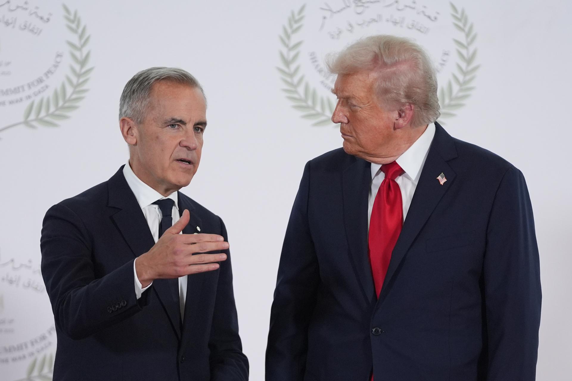 President Donald Trump greets Canada's Prime Minister Mark Carney Oct. 13 in Sharm El Sheikh, Egypt.