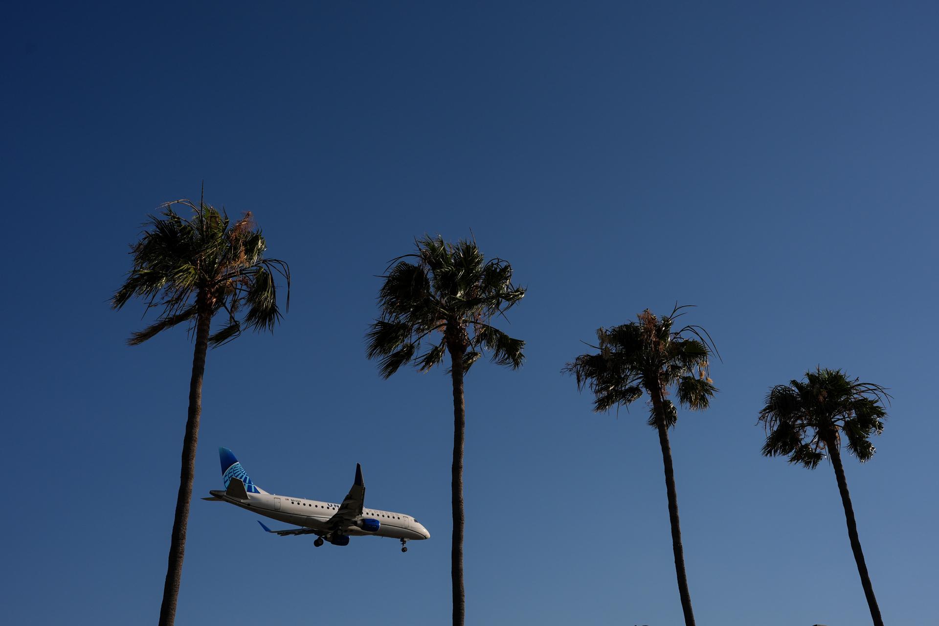 A United Airlines passenger jet approaches Los Angeles International Airport, May 20.