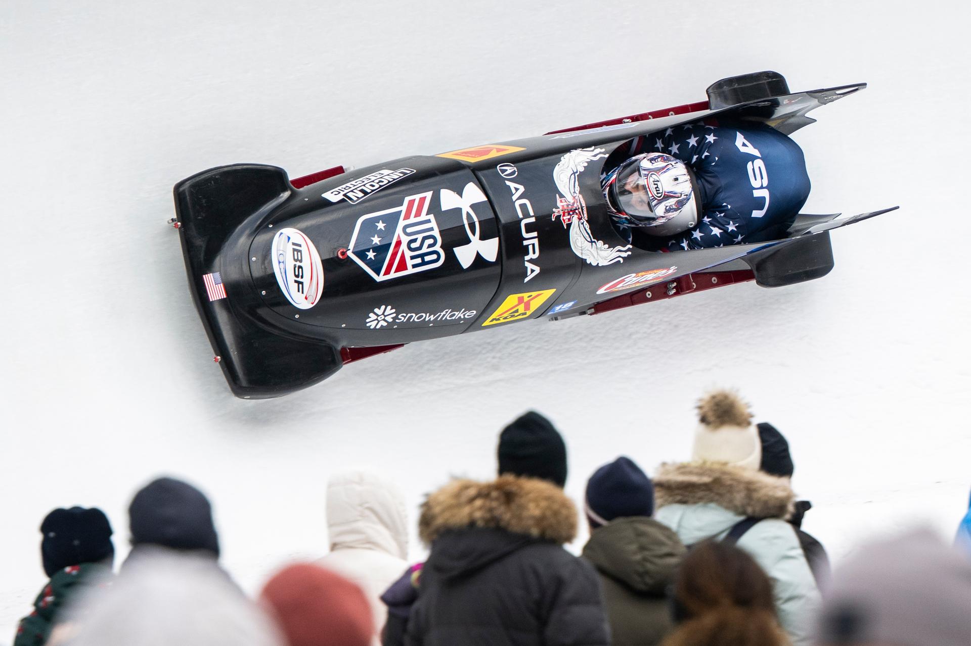 Kristopher Horn and Carsten Vissering during a World Cup race in St. Moritz, Switzerland, on Saturday. (Mayk Wendt/Keystone via AP)