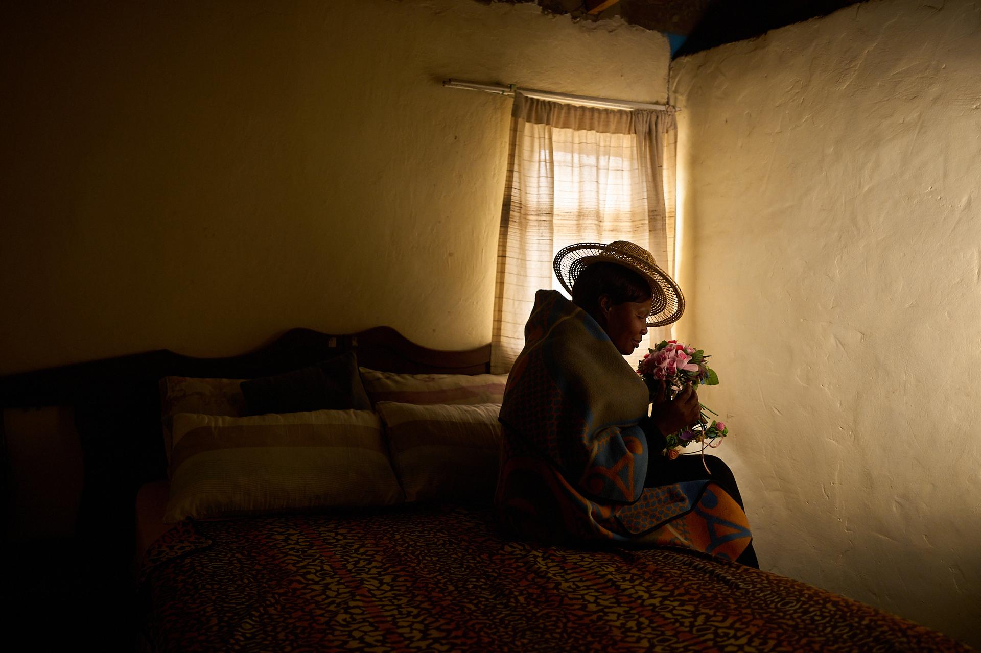 Lisebo Lechela, 54, an HIV-positive sex worker turned activist and health worker, poses for a portrait in her house in Maputsoe, Lesotho, July 17. (AP Photo/Bram Janssen)