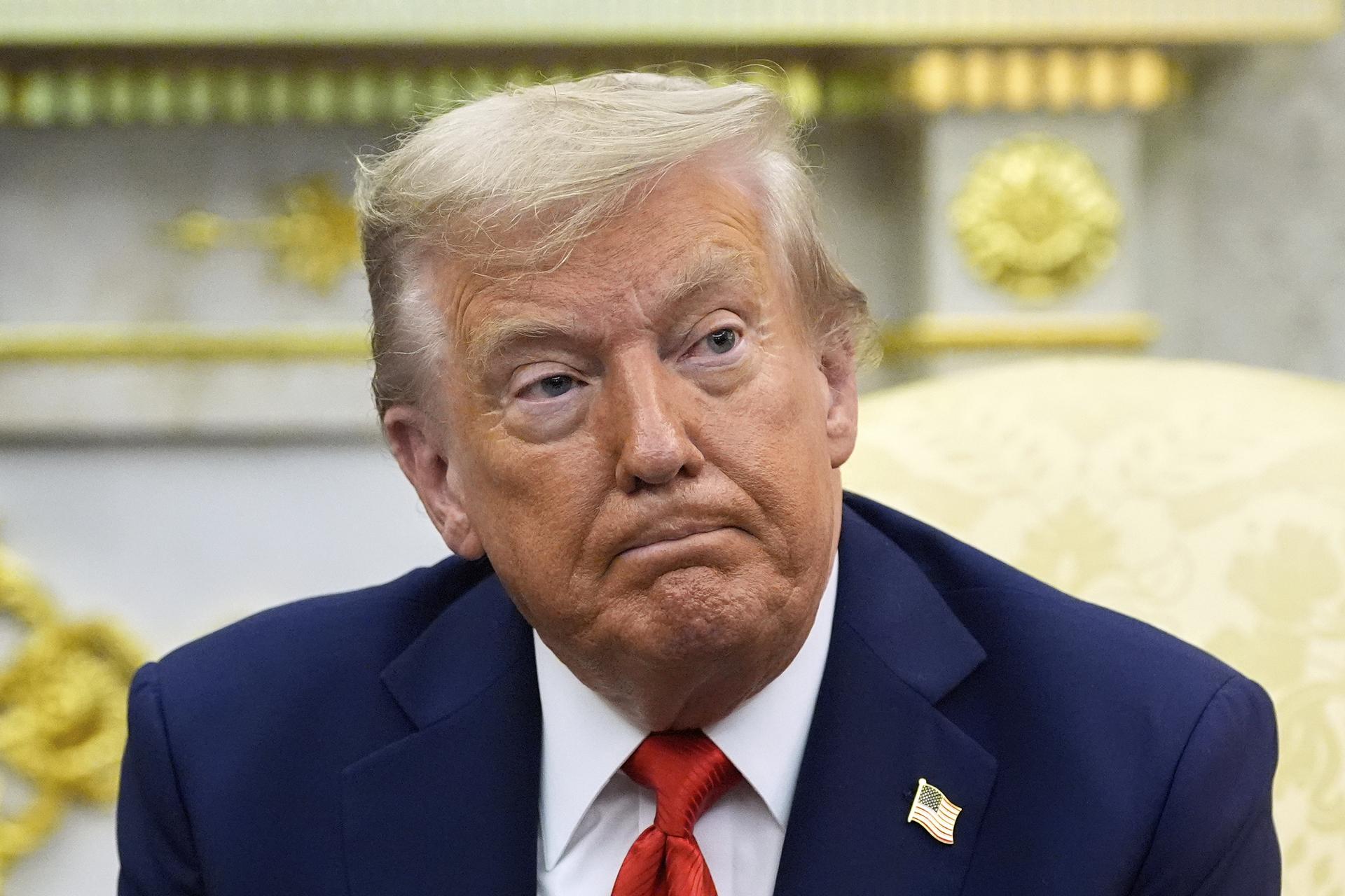 President Donald Trump listens during a meeting with South Korean President Lee Jae Myung in the Oval Office of the White House on Monday. (AP Photo/Alex Brandon)