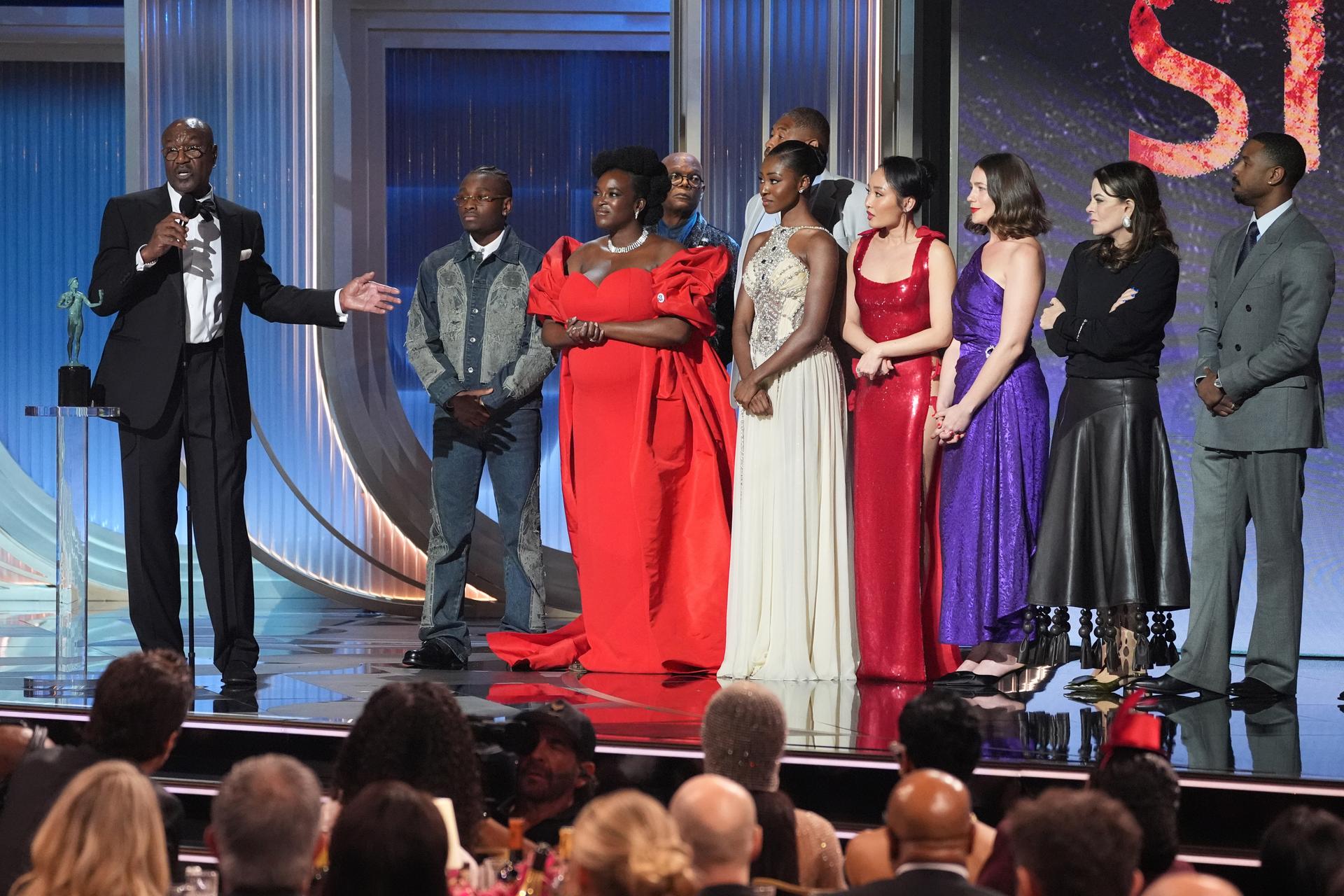 Delroy Lindo, from left, Miles Canton, Wunmi Mosaku, Omar Benson Miller, Jayme Lawson, Li Jun Li, Lola Kirke, Francine Maisler, and Michael B. Jordan accept the award for outstanding performance by a cast in a motion picture for 