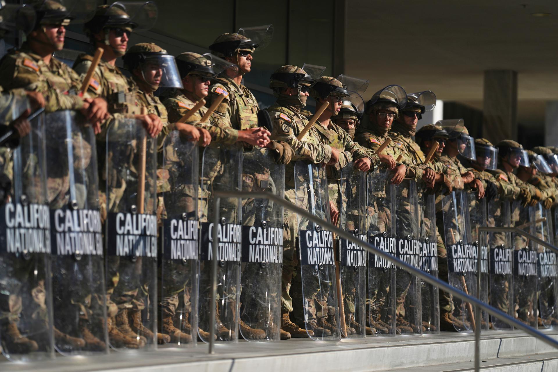 California National Guard are positioned at the Federal Building in downtown Los Angeles on June 10. (AP Photo/Eric Thayer)