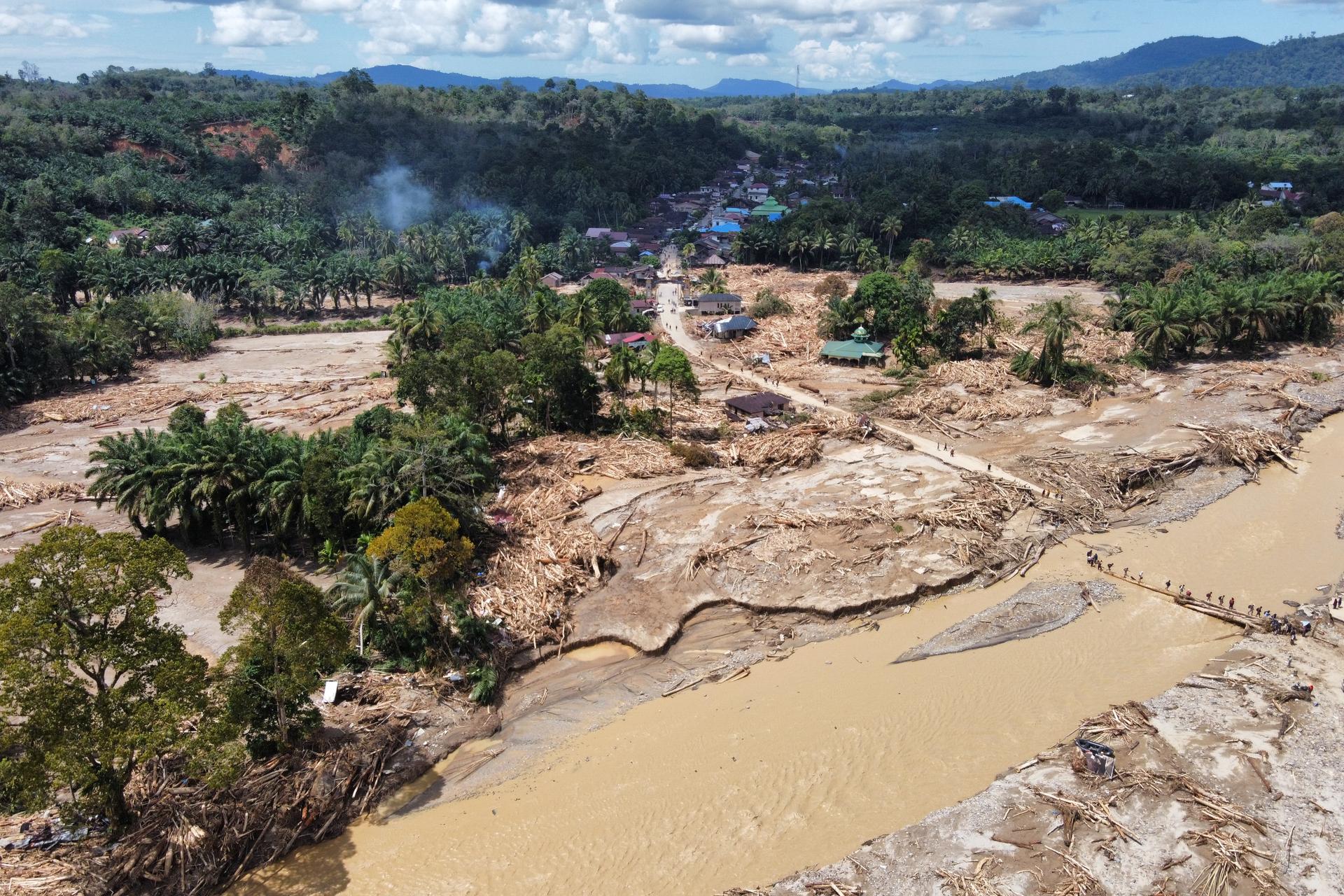 This drone photo shows a village affected by a flash flood in Batang Toru, North Sumatra, Indonesia, on Monday. (AP Photo/Binsar Bakkara)