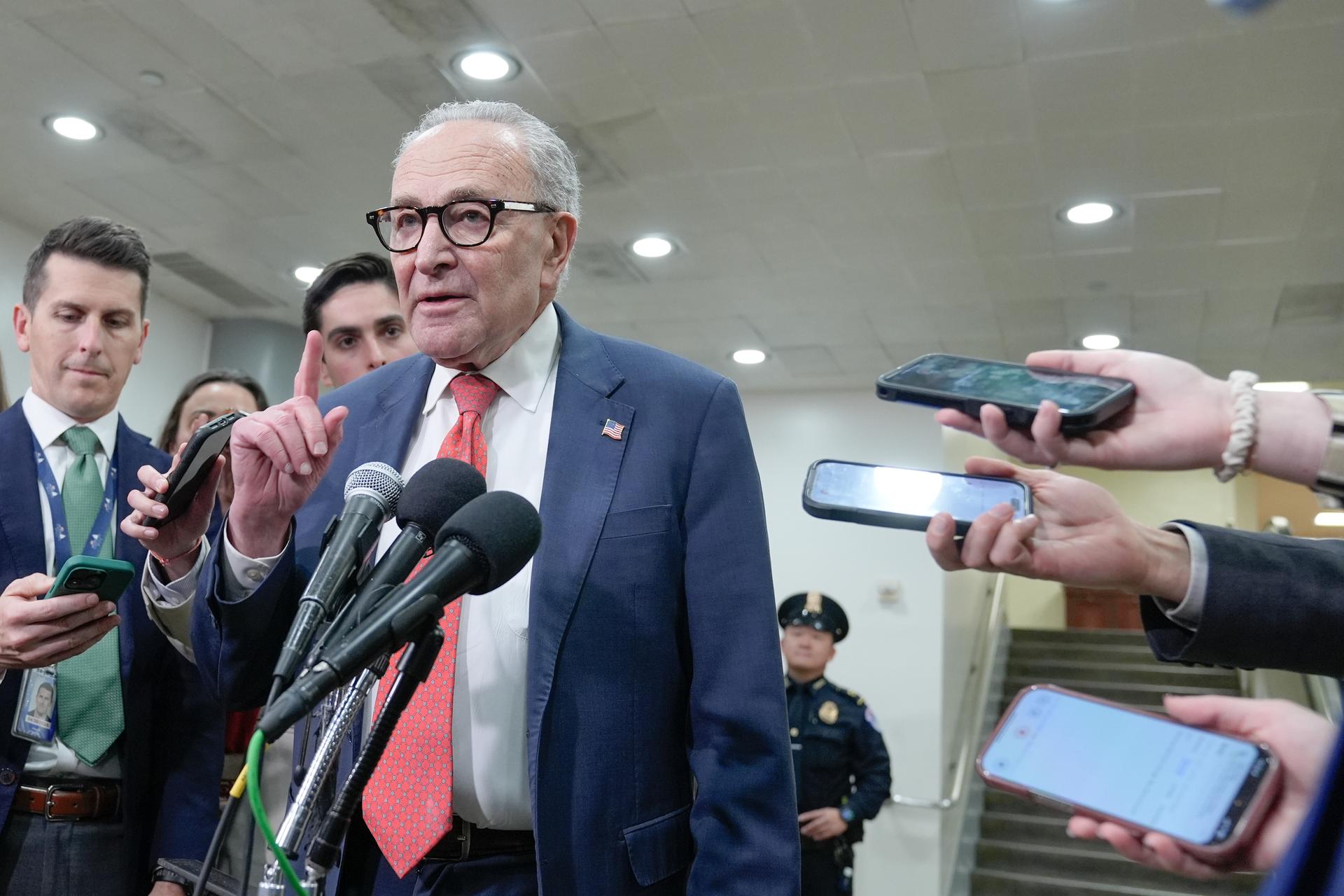 Sen. Minority Leader Chuck Schumer of N.Y., speaks with reporters at the Capitol Subway on the 36th day of the government shutdown, Wednesday, in Washington. 