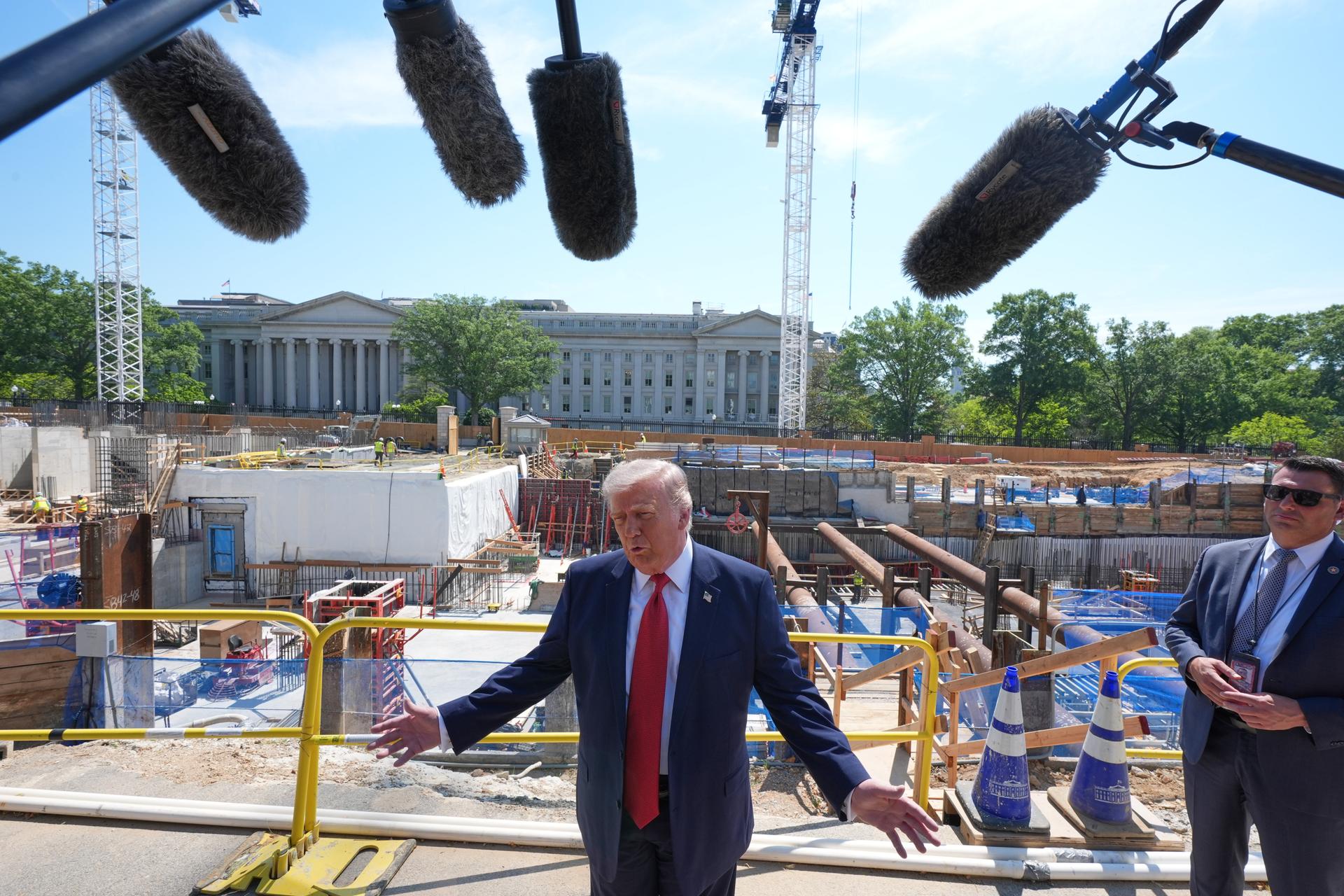 President Donald Trump tours Ballroom construction around the outside of the White House on Tuesday. (AP Photo/Jacquelyn Martin)