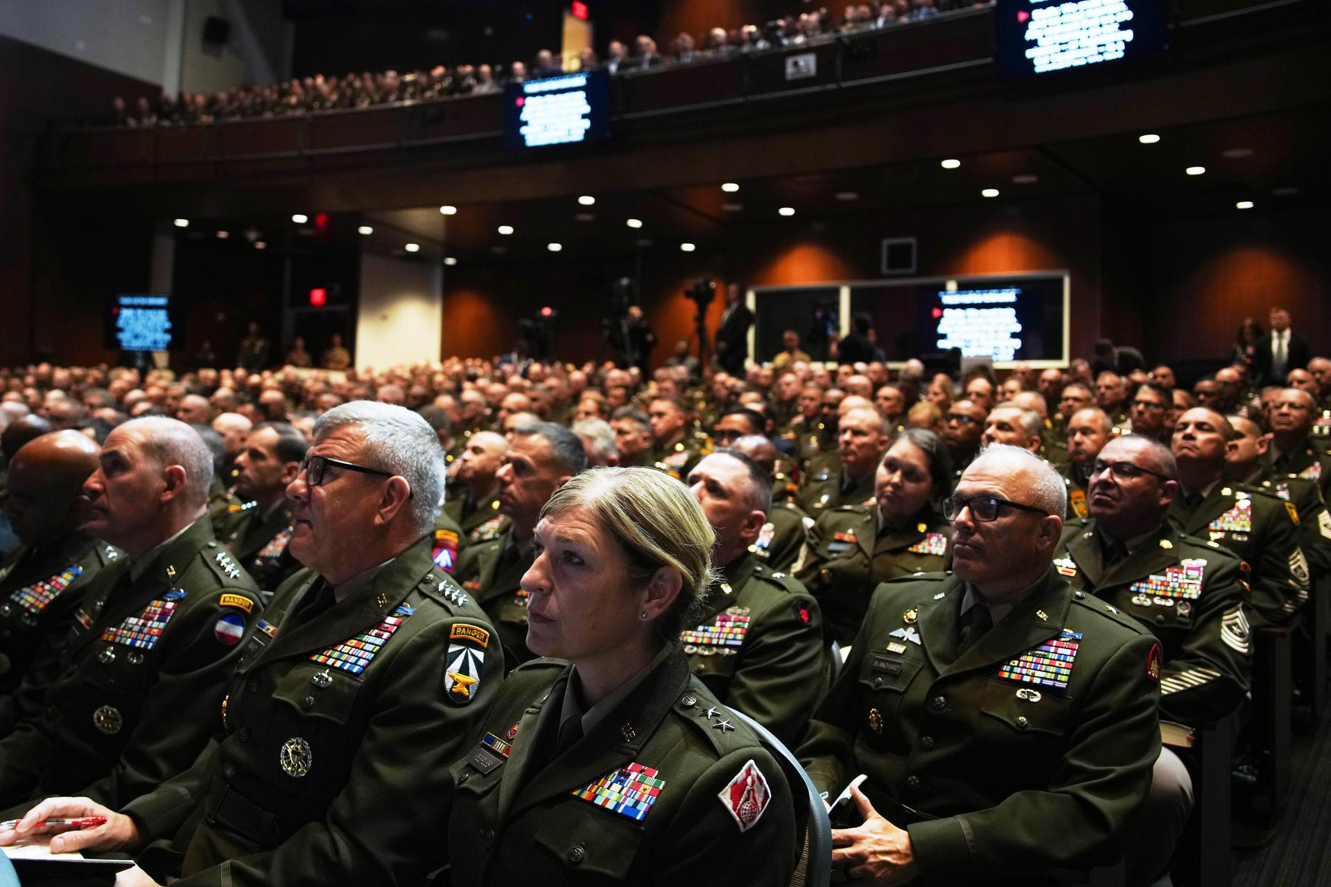 U.S. military senior leadership listen as President Donald Trump speaks at Marine Corps Base Quantico on Tuesday. (Andrew Harnik/Pool via AP)