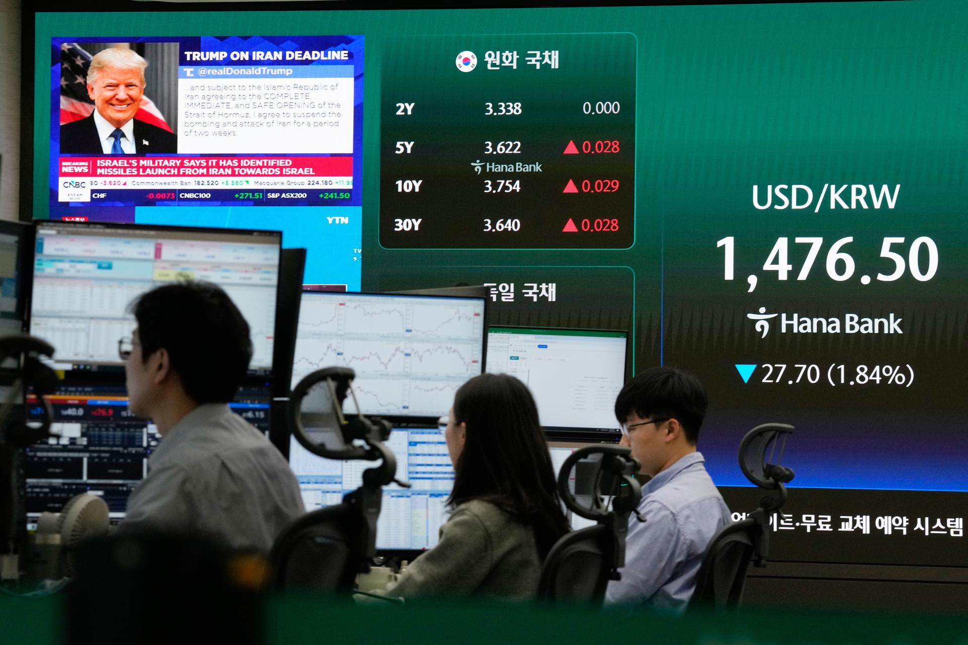 U.S. President Donald Trump is seen on a screen as traders work at the foreign exchange dealing room of the Hana Bank headquarters in Seoul, South Korea, on Wednesday.