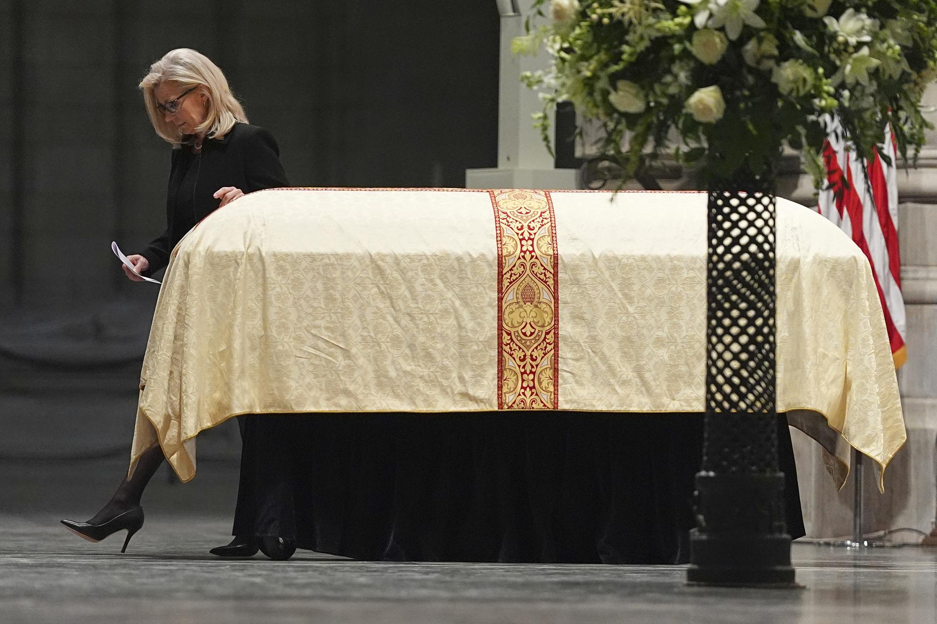 Former Rep. Liz Cheney walks past her father's casket at the Washington National Cathedral on Thursday. (AP Photo/Matt Rourke)
