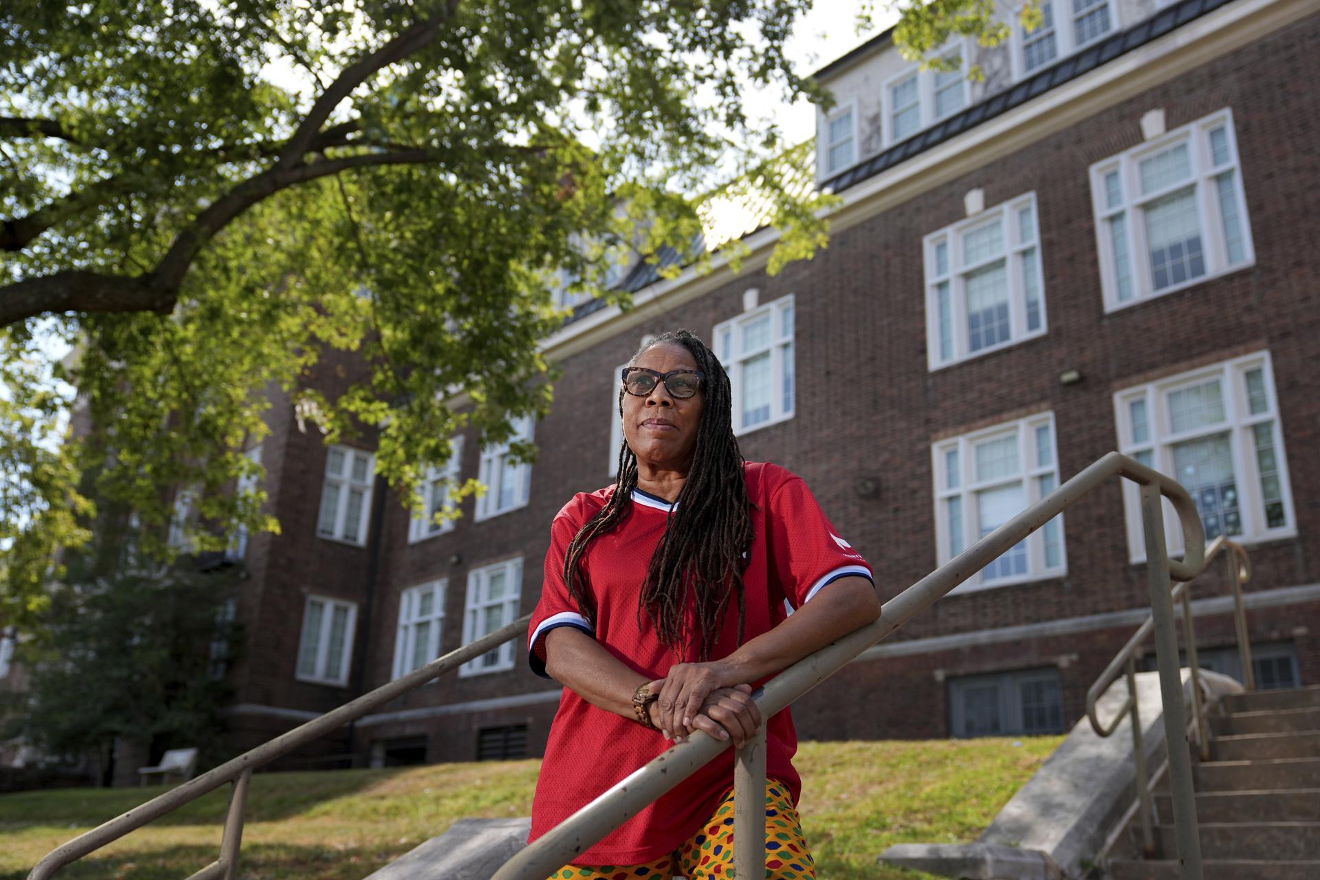 Thomasina Clarke poses for a photo outside Sumner High School in St. Louis on Thursday. (AP Photo/Jeff Roberson)